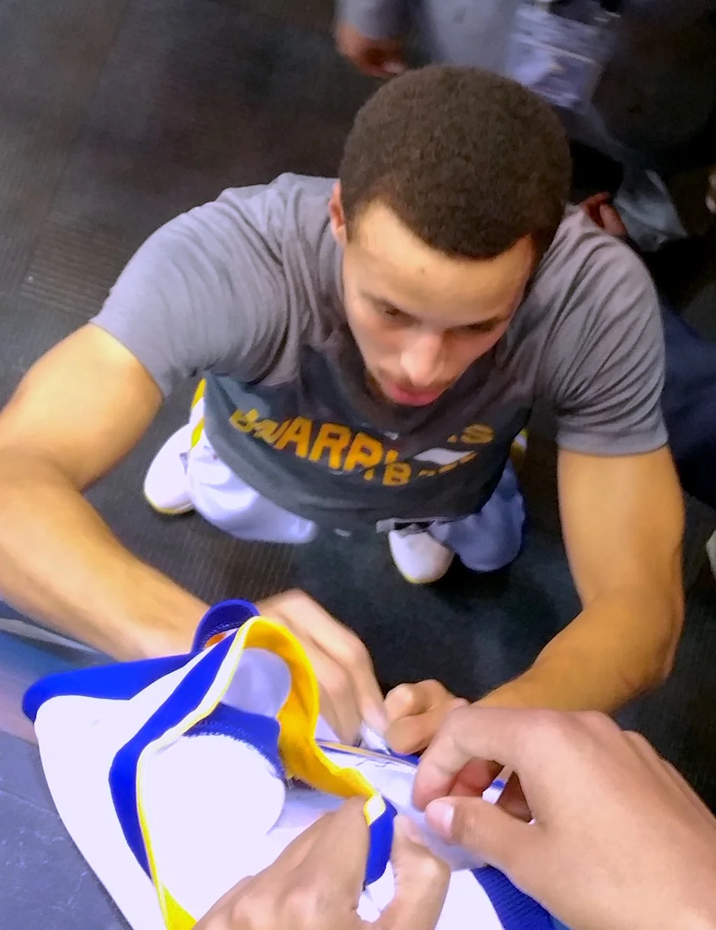 Stephen Curry signing autographs at Oracle Arena. Photo by Joe Ghio.