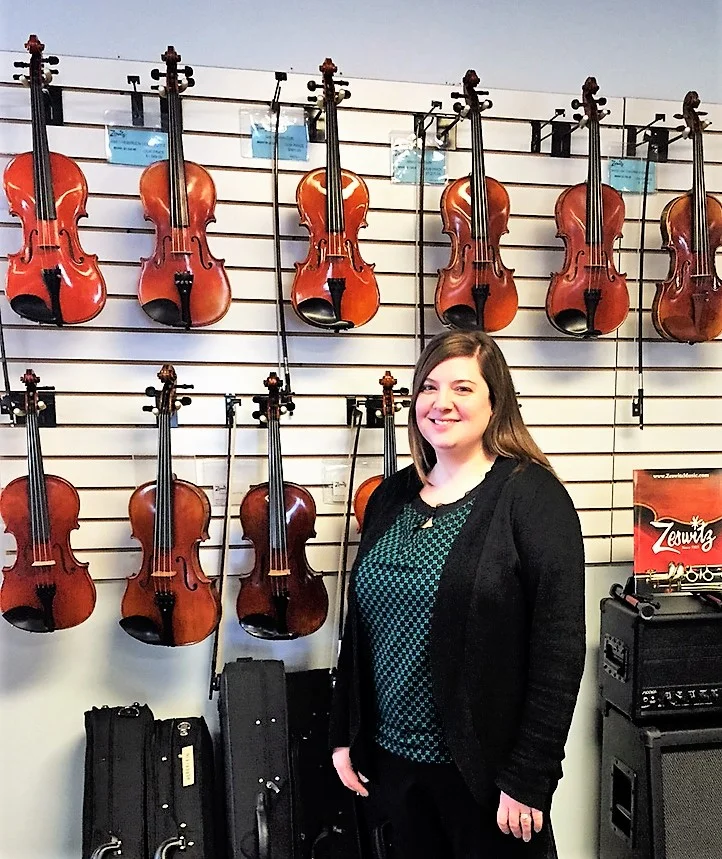 Sonya Hoffman with some of Zeswitz Music's step-up Violin inventory in their Reading, PA Showroom