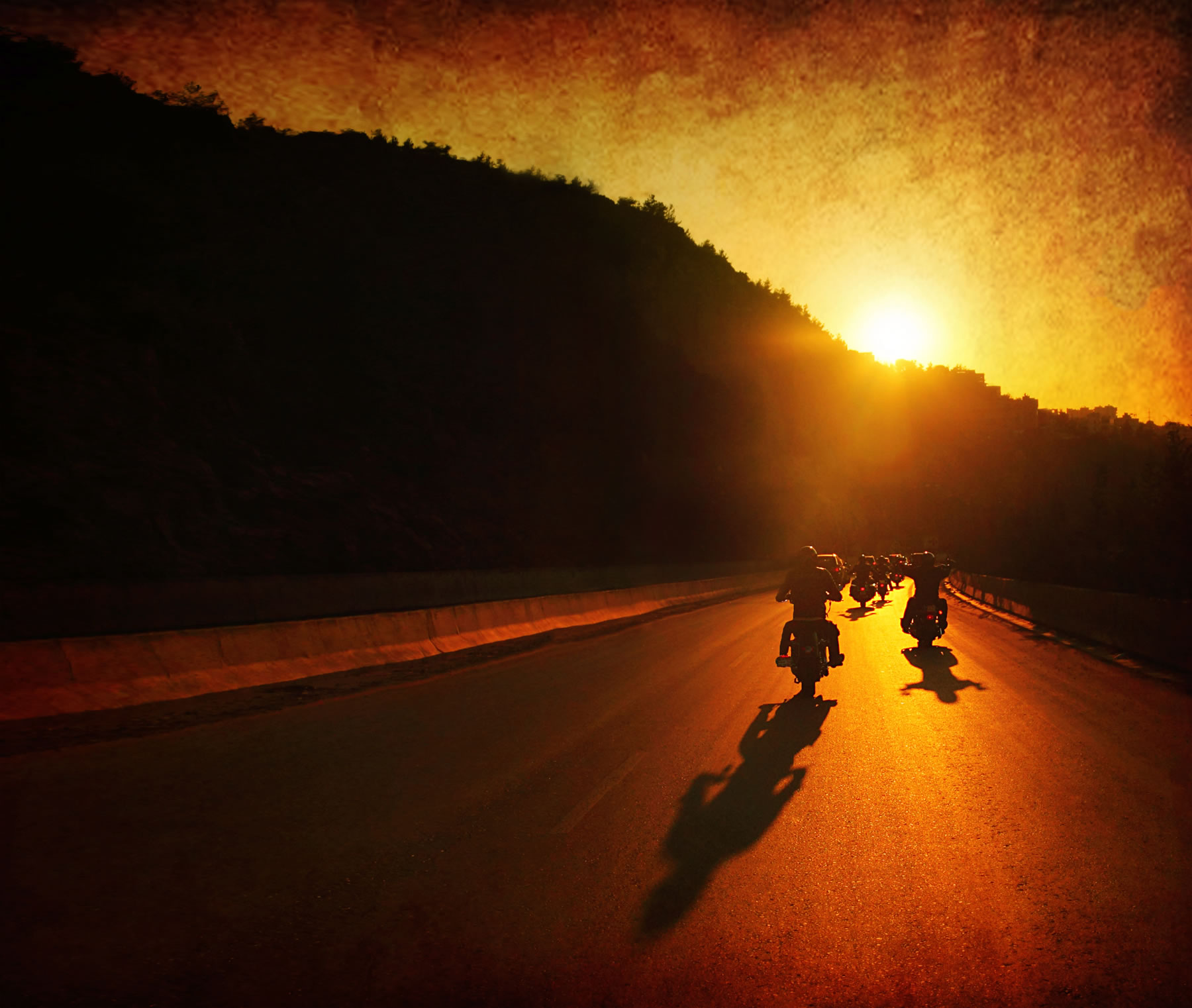 group_riding_into_sunset_wide.jpg