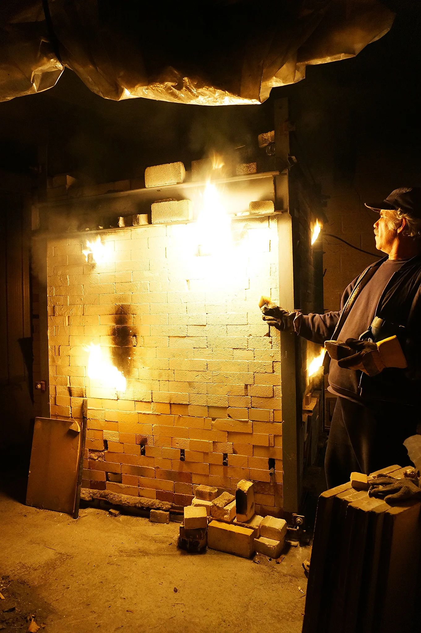 Joseph doing some final checks at the end of a firing.