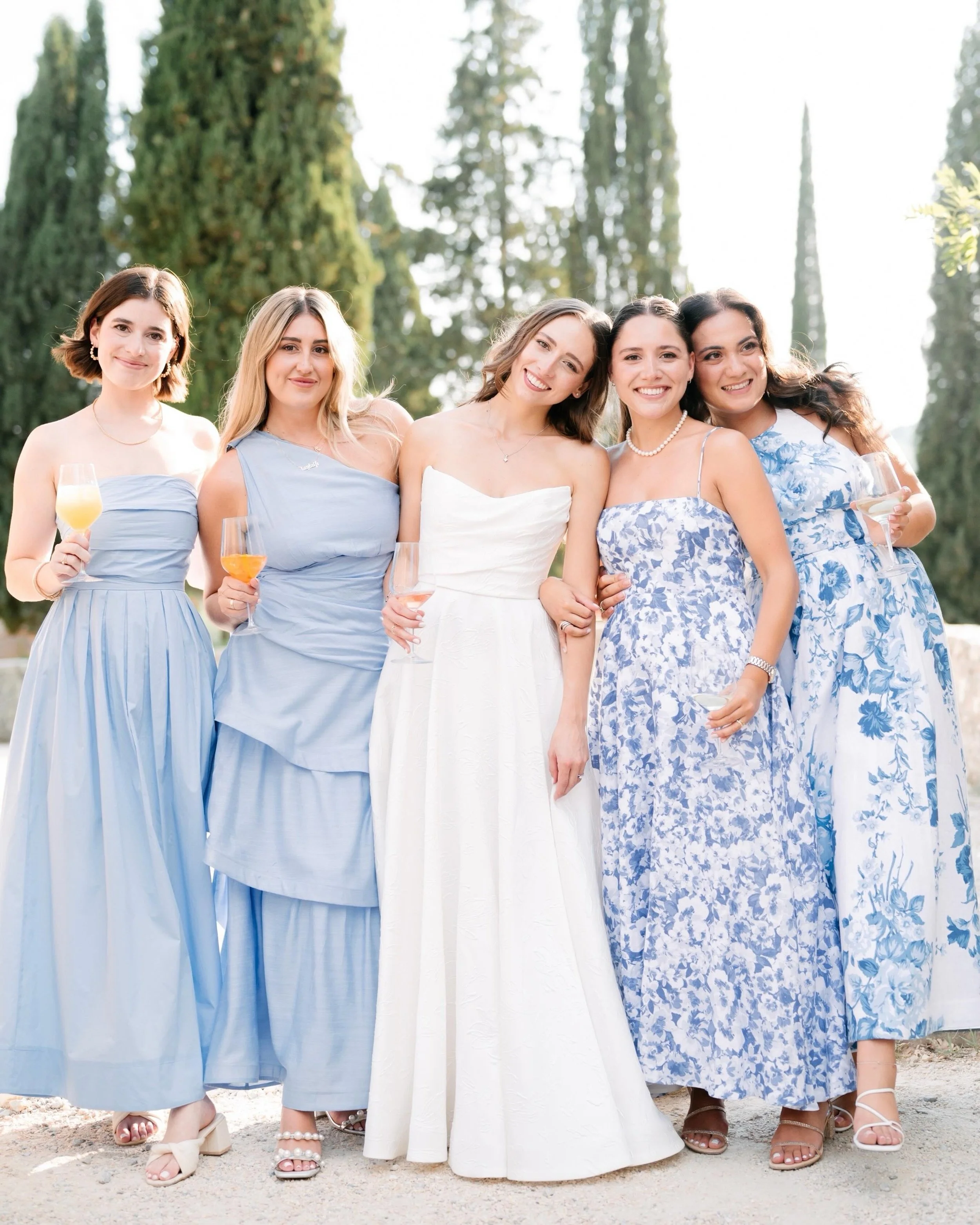 Aperitivo mood: the bride and her girls in blue, laughing their way through golden hour. 

Wp: @ilaria.wp 
Photographer: @landvphotography 
Venue: @borgodipietrafitta 
Flowers: @marielou_fiori 
Entertainment: @tastensax 
Catering: @class_ricevimenti 