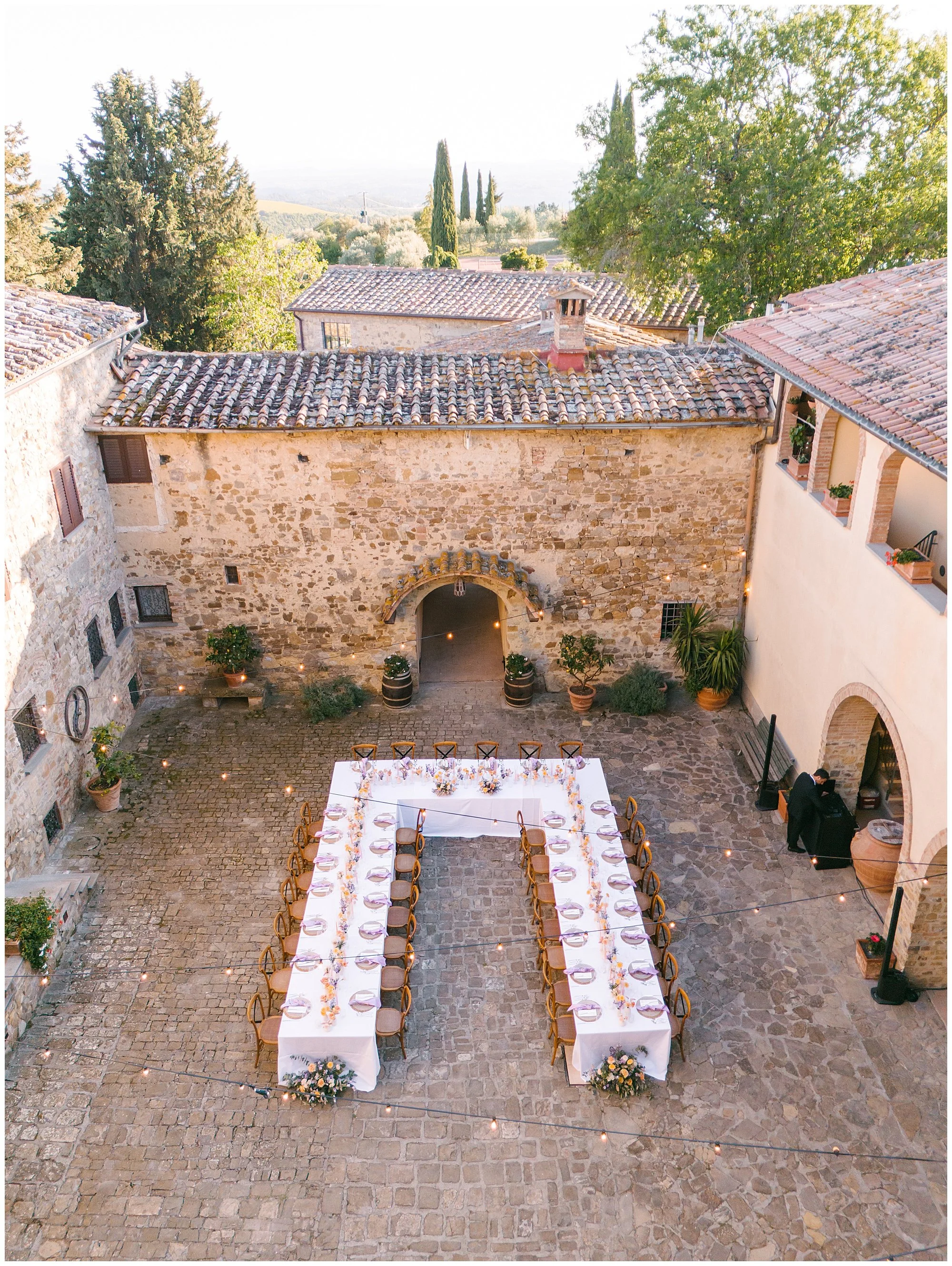 Luxury wedding venue in Tuscany, aerial view of a private estate during golden hour, photographed by L&V Photography
