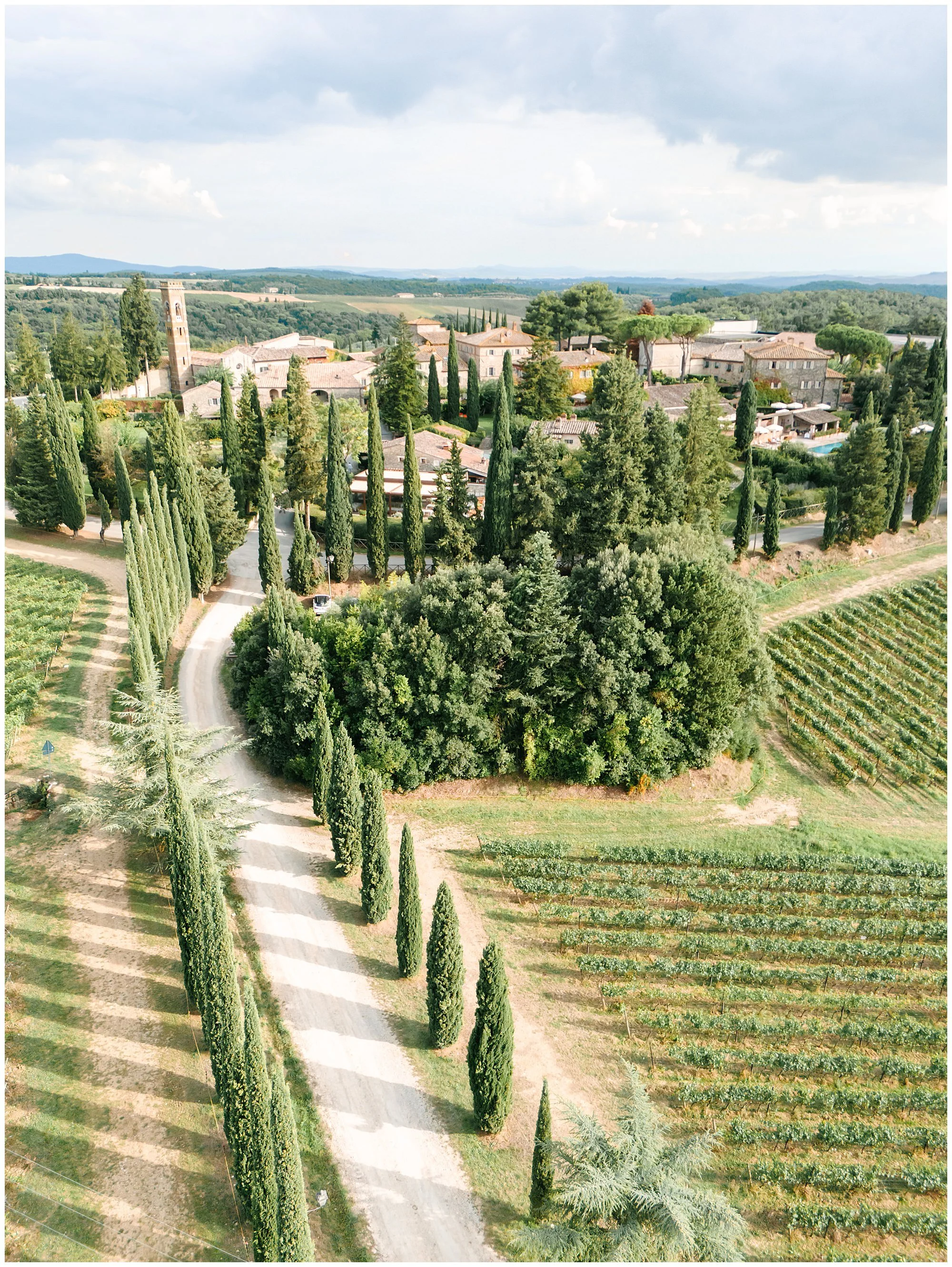 Luxury wedding venue in Tuscany, aerial view of Borgo San Felice during golden hour, photographed by L&V Photography Letizia Maccarini