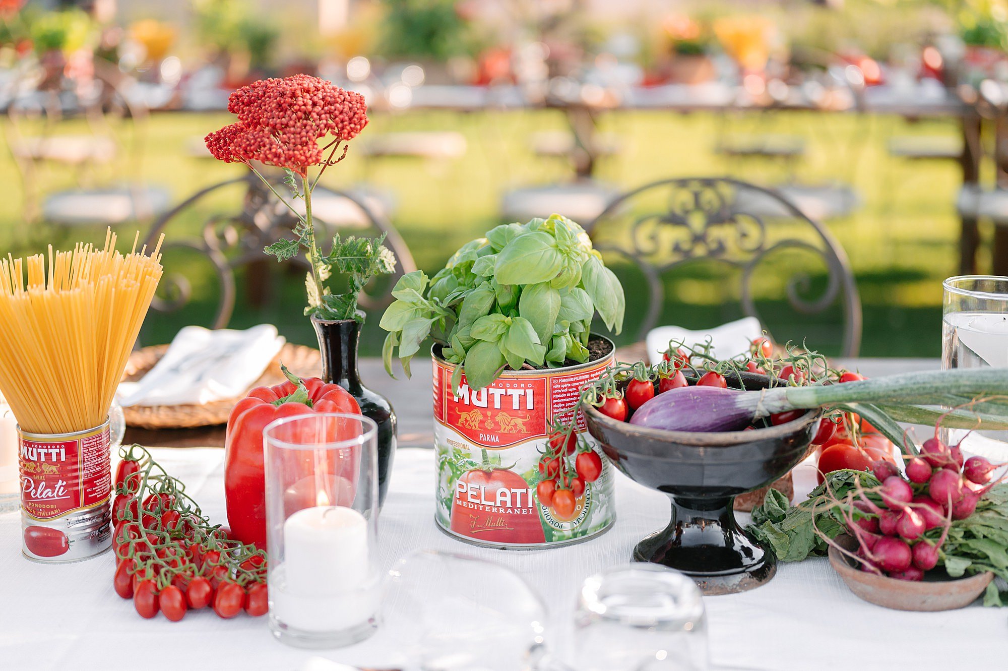 Chic Italian pizza party at a Tuscan villa with long wooden tables and rustic chic decor.