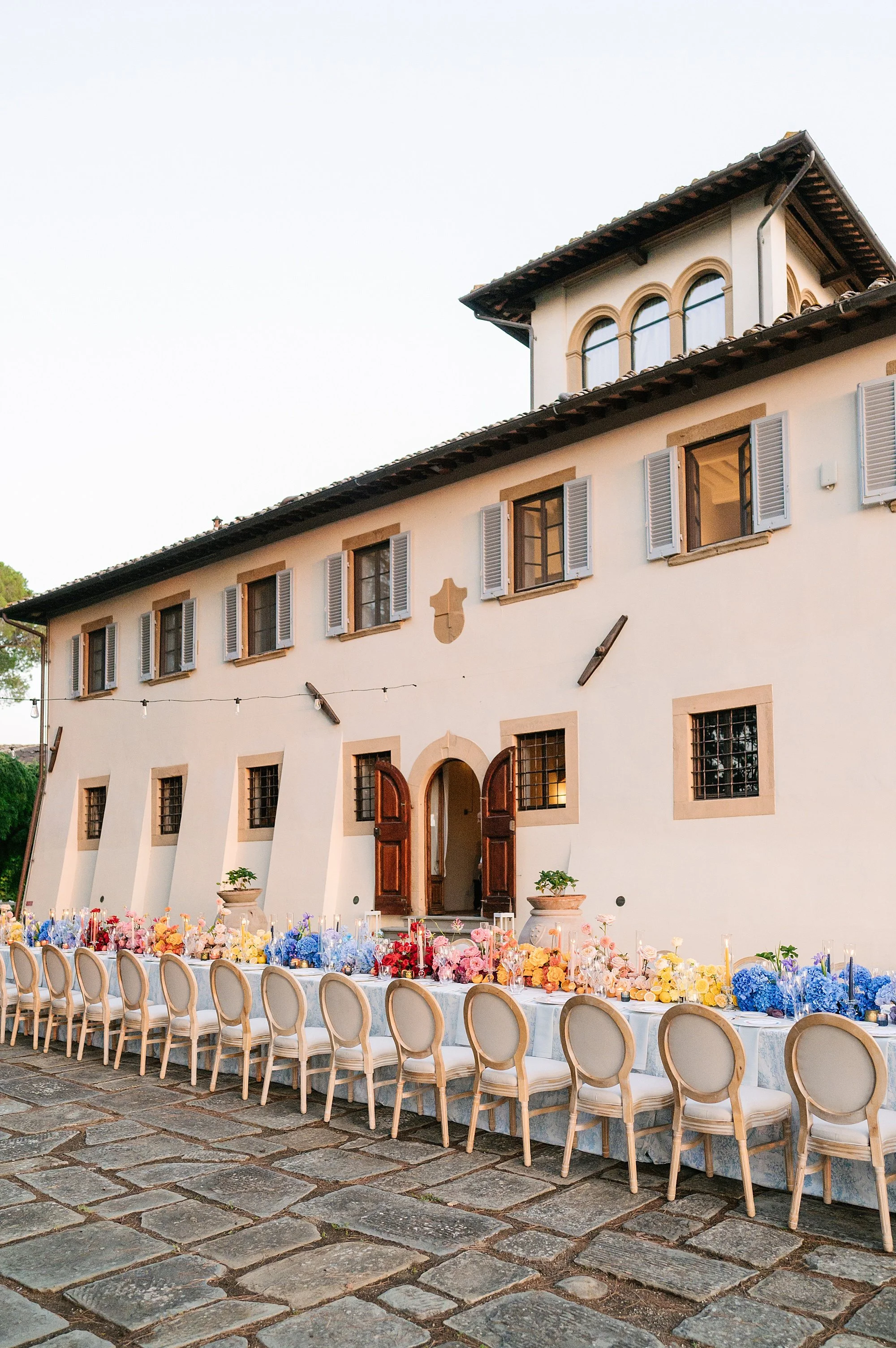 Luxury wedding venue in Tuscany, aerial view of a private estate during golden hour, photographed by L&V Photography