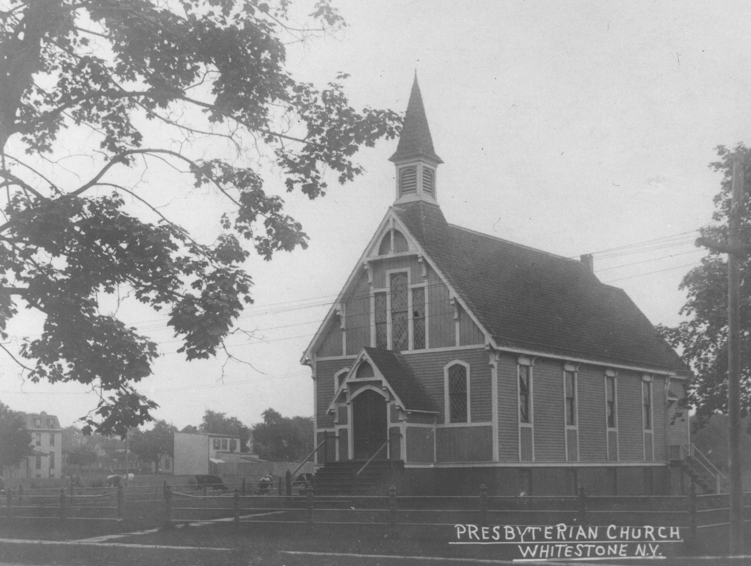 The church building in the early 1900s, before the construction of the auditorium. Note the cows grazing just beside the church!