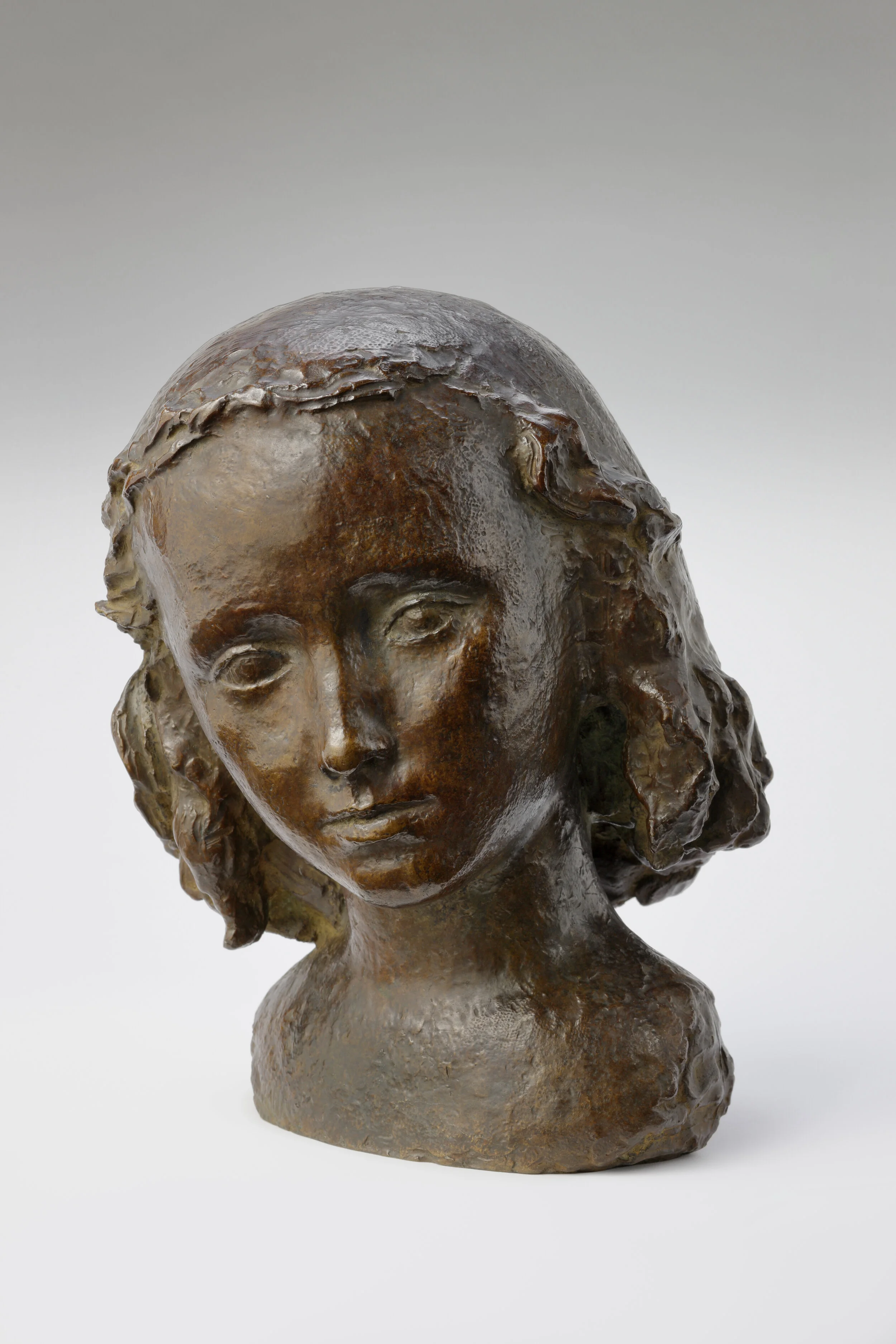   Paul Belmondo (1898-1982)    Head of a Girl      French School, c. 1940     Bronze with brown patina and black marble base      H: 44 cm with base     Same bronze at the Paul Belmondo Museum at the Art Museum in Boulogne-Billancourt, France     Ref