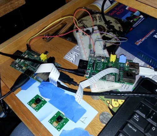 2 raspberry pi's each with their own camera, and my messy desk