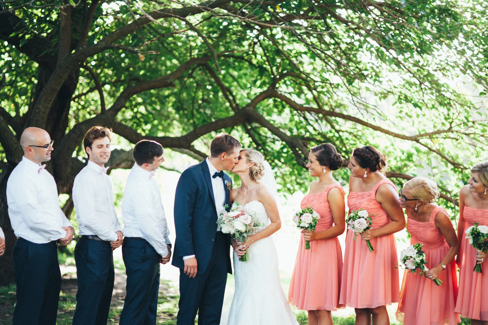 Bride and groom and wedding party in the country