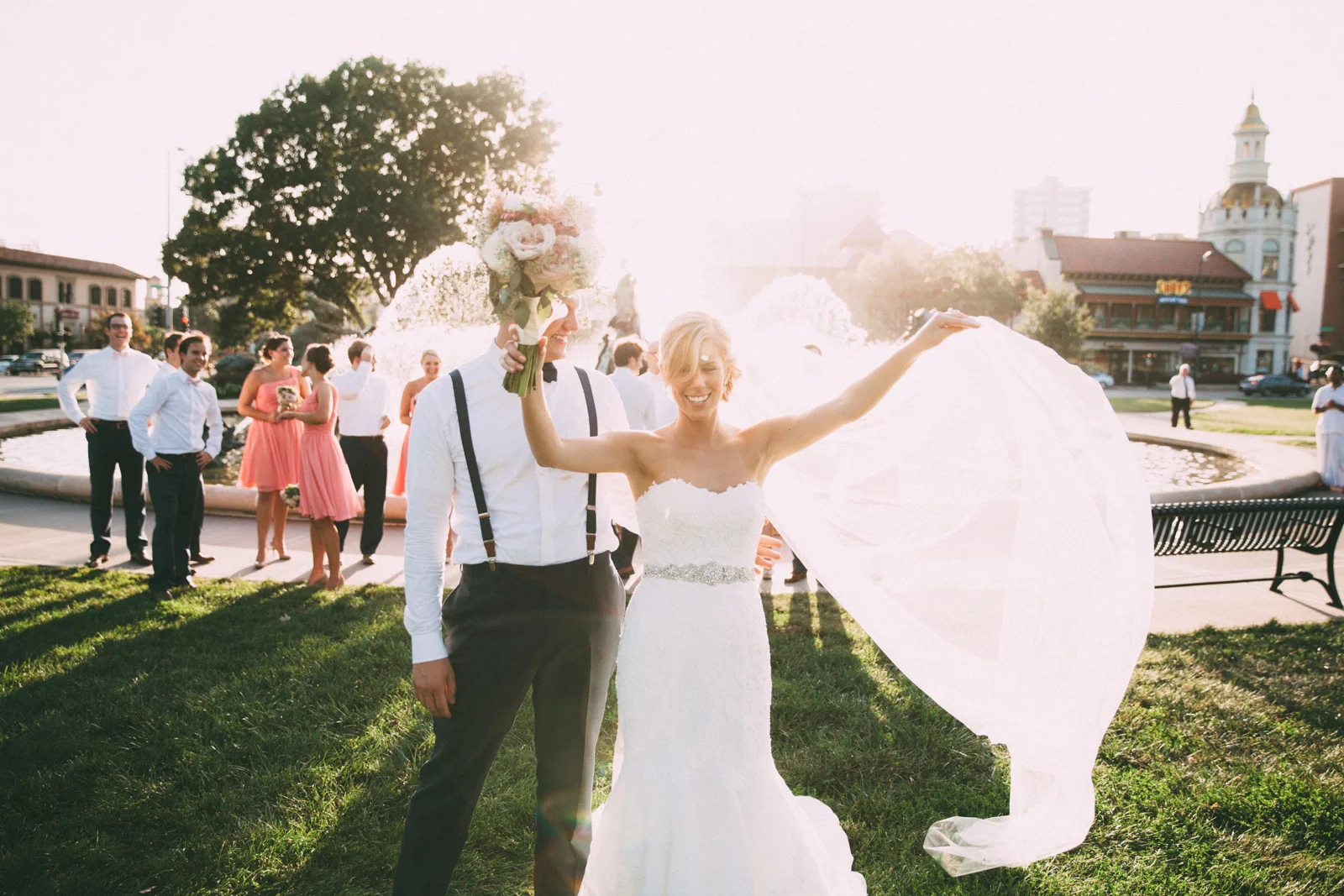 Bride and groom with wedding party in front of famous JC Nichols Kansas City fountain