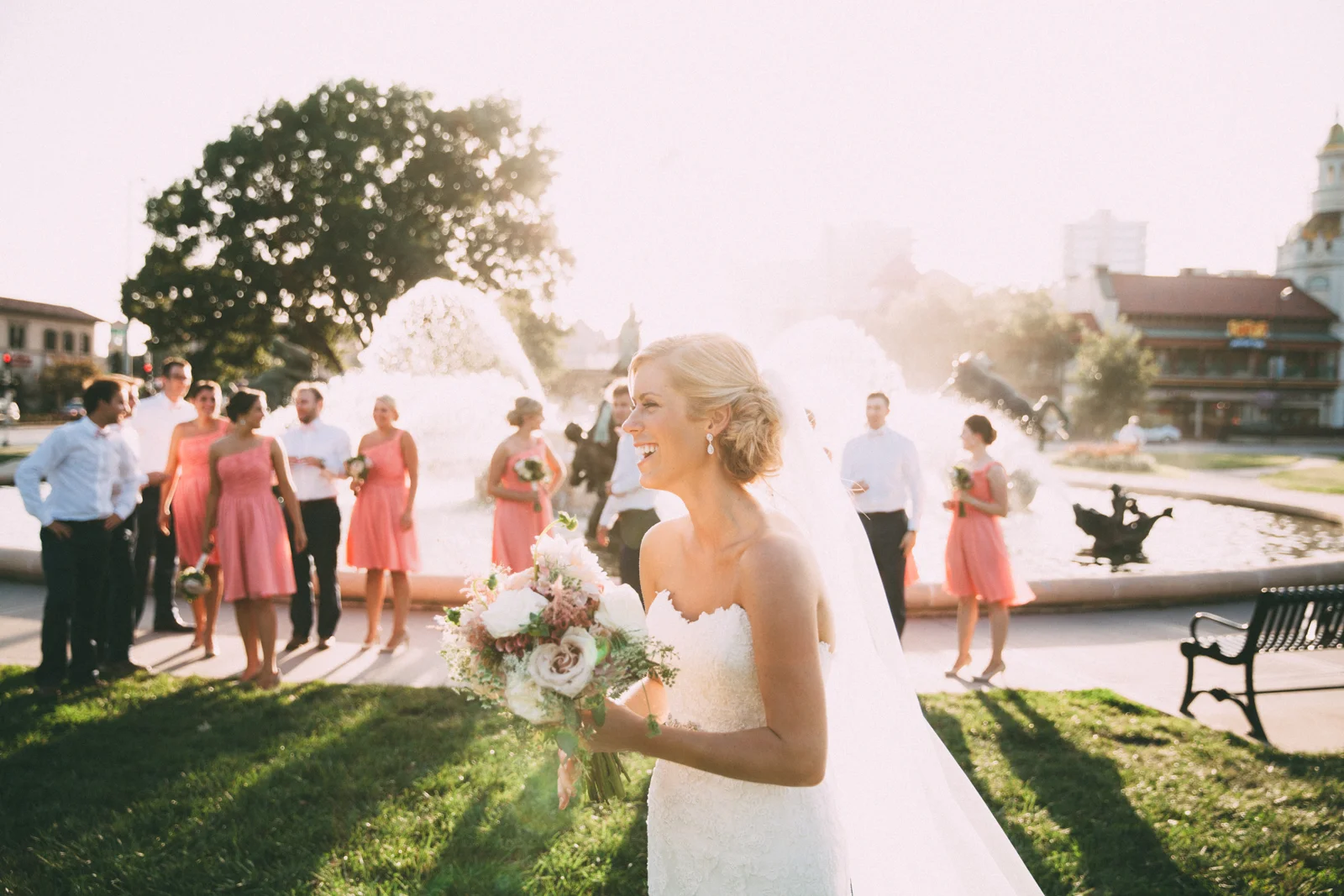 Bride and groom with wedding party in front of famous JC Nichols Kansas City fountain