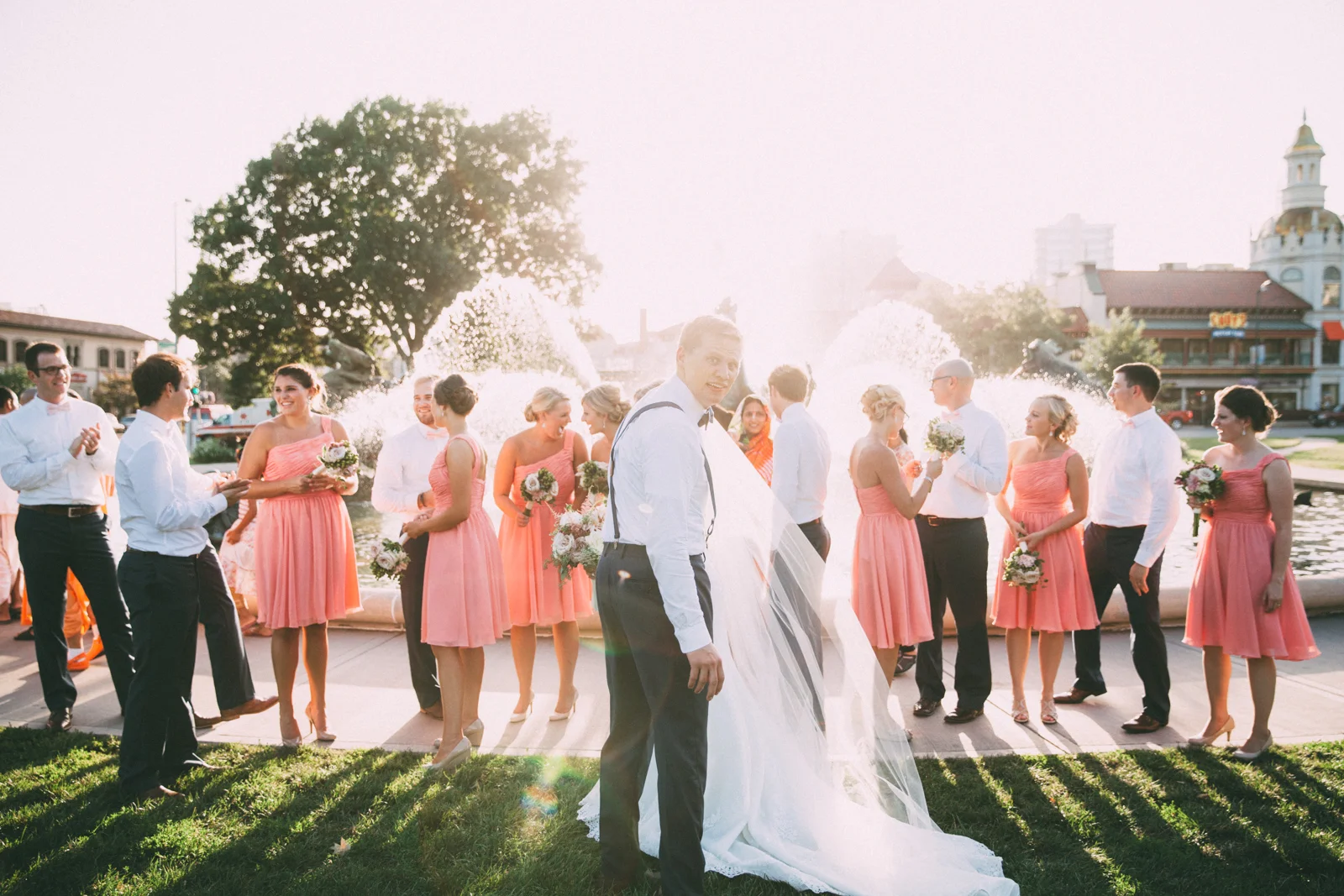 Bride and groom with wedding party in front of famous JC Nichols Kansas City fountain