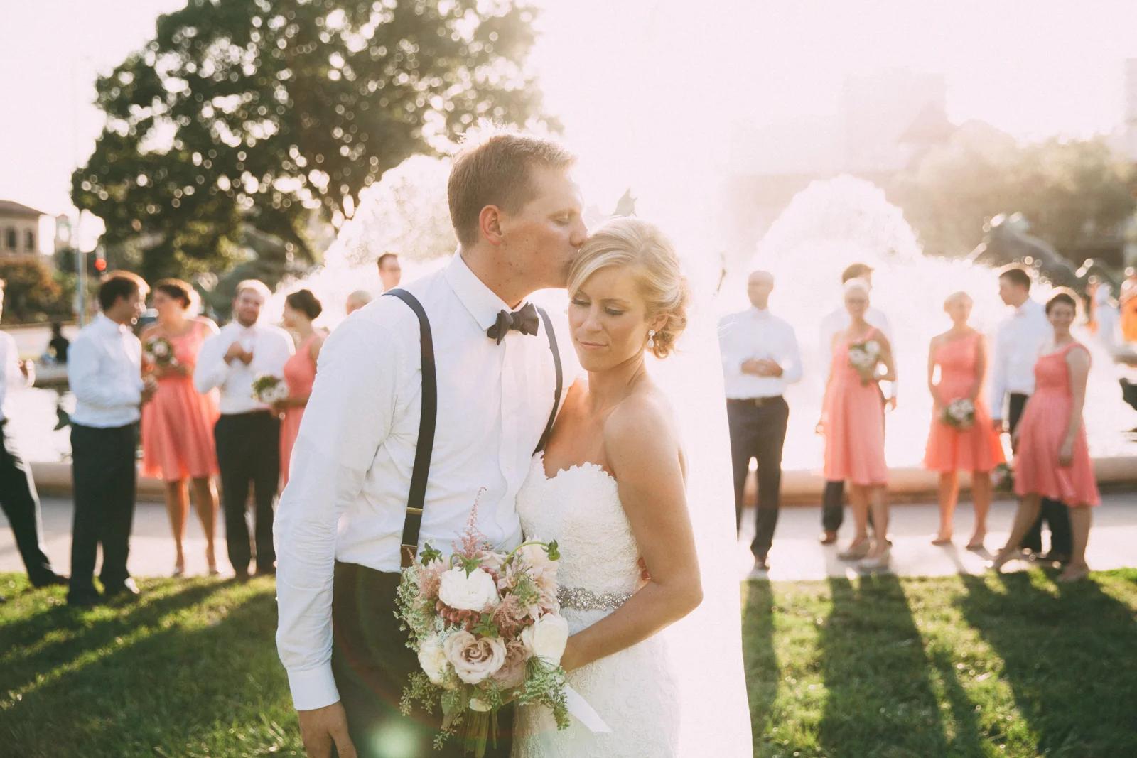 Bride and groom with wedding party in front of famous JC Nichols Kansas City fountain