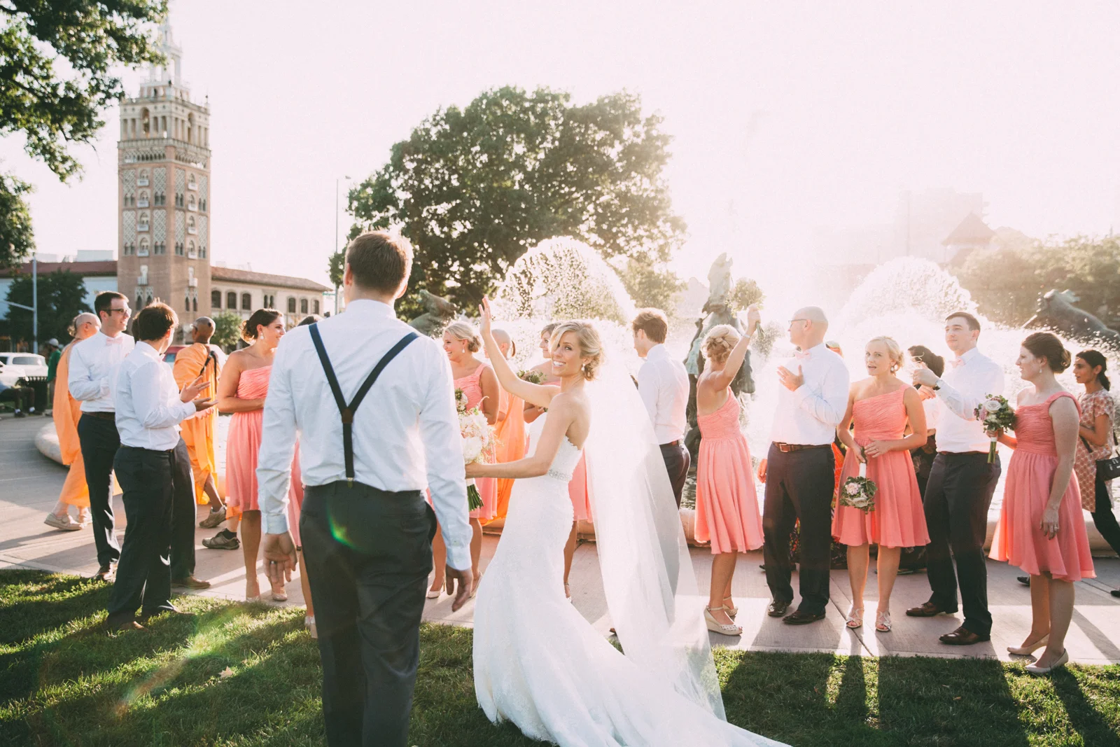 Bride and groom with wedding party in front of famous JC Nichols Kansas City fountain