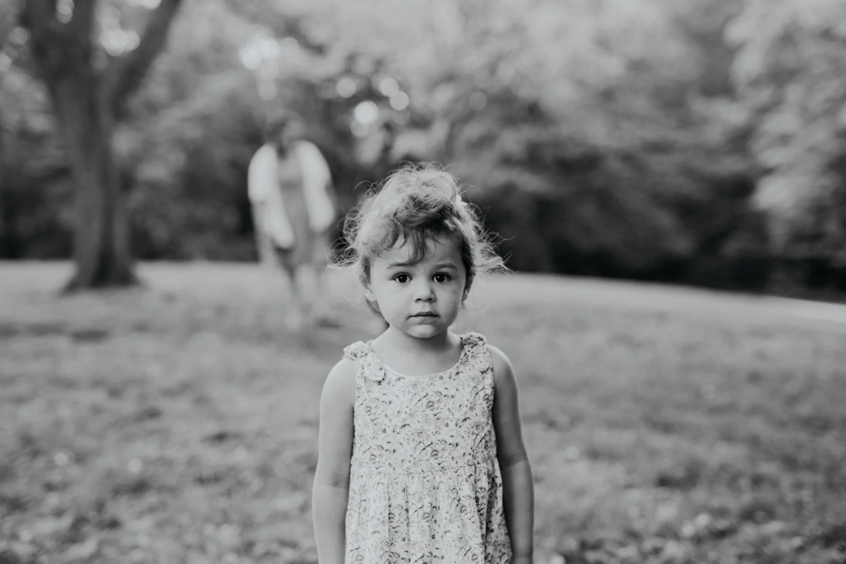Cute young girl standing in open field