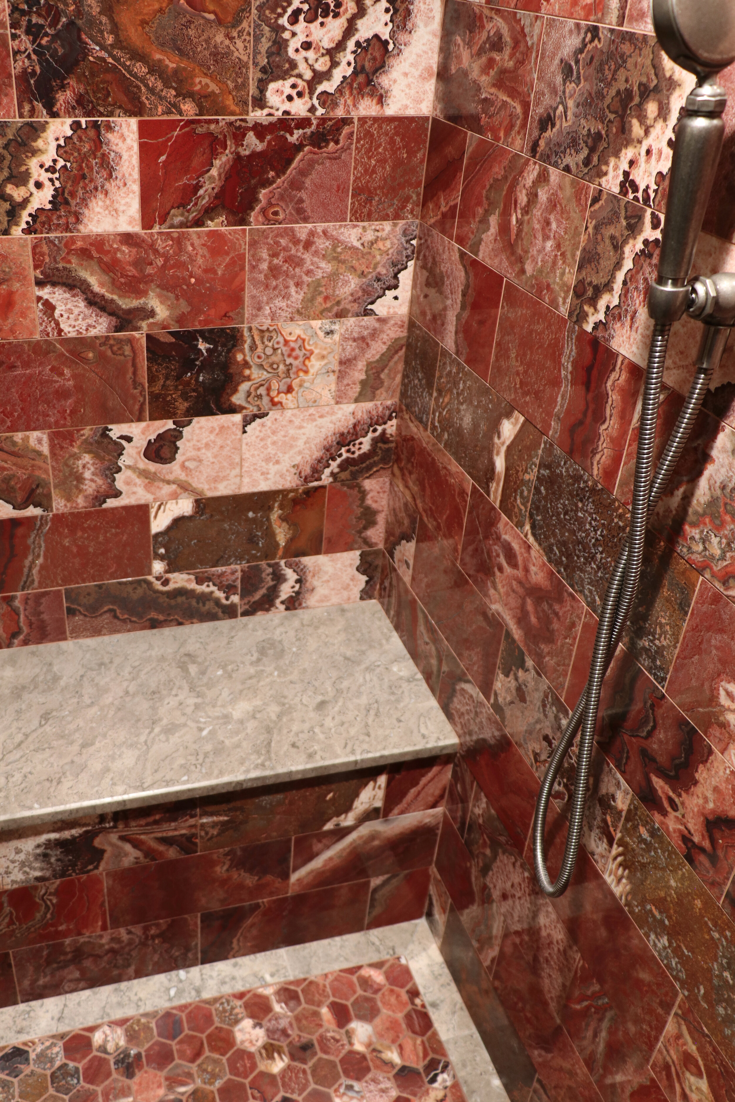  Sage Gray 13” x 50” shower bench shown with Red Onyx 6” x 12” and hexagon mosaic 