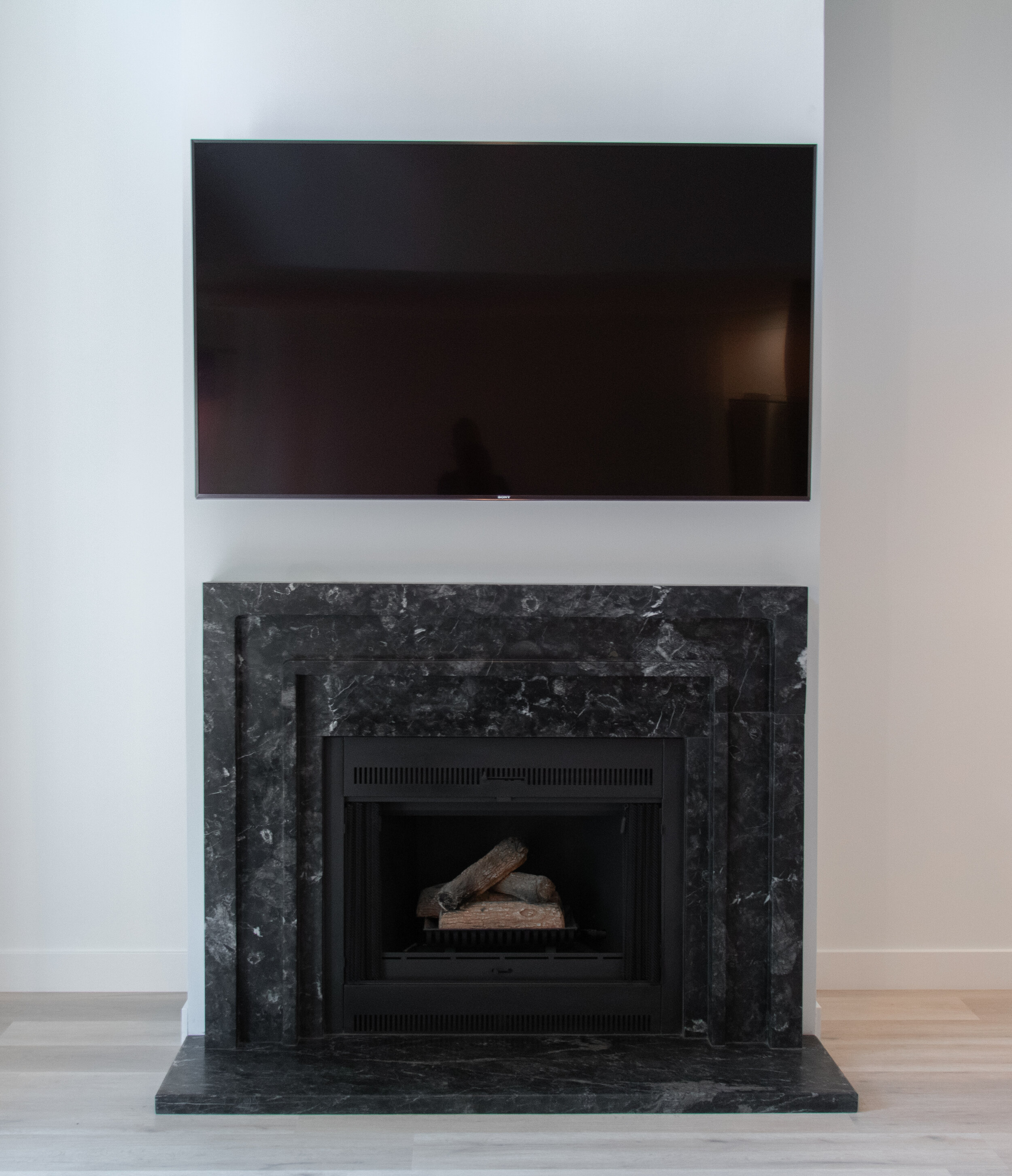 Custom Black Marble Fireplace Surround | Castelli Marble