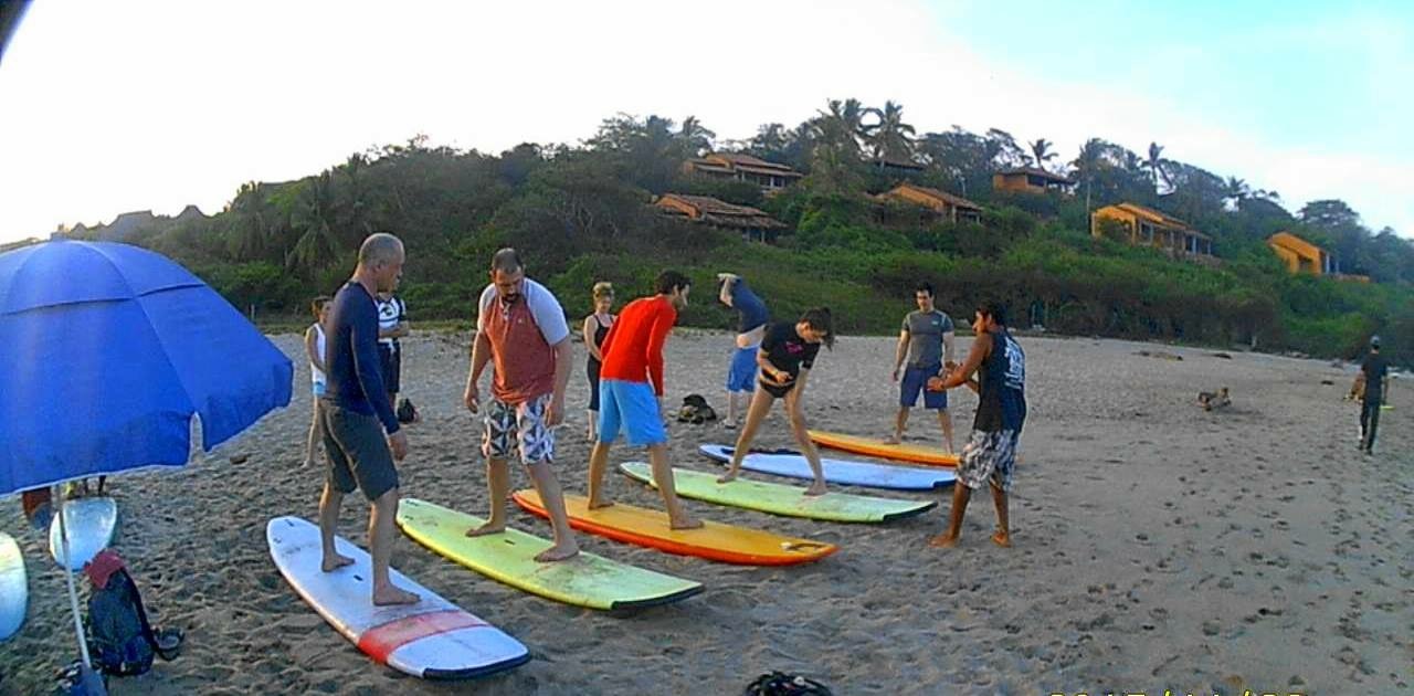The crew learning to surf