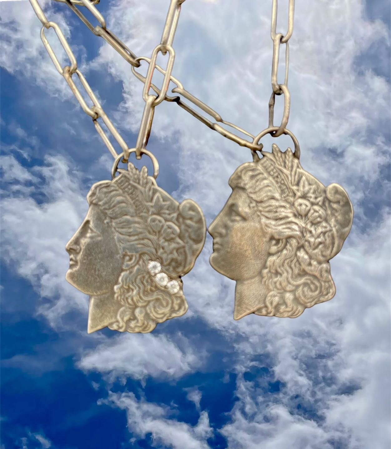Lucy in the Sky with Diamonds 
These lovelies are hand cut from 1883 and 1921  silver dollars.  If you look closely the word Liberty is embossed on her head band. 
Women hadn&rsquo;t been given the right to vote till 1920✔️