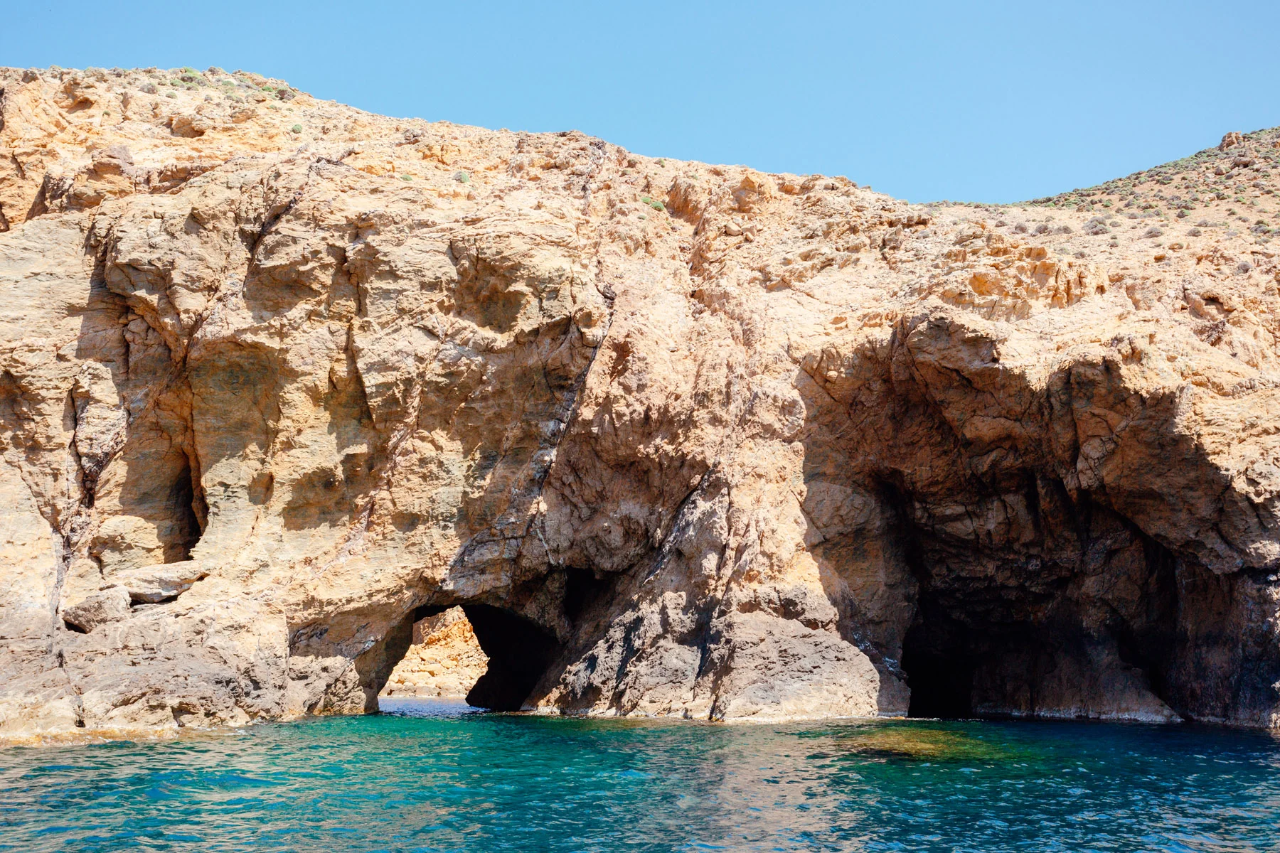 Entering the caves on the nearby island of Dragonisi