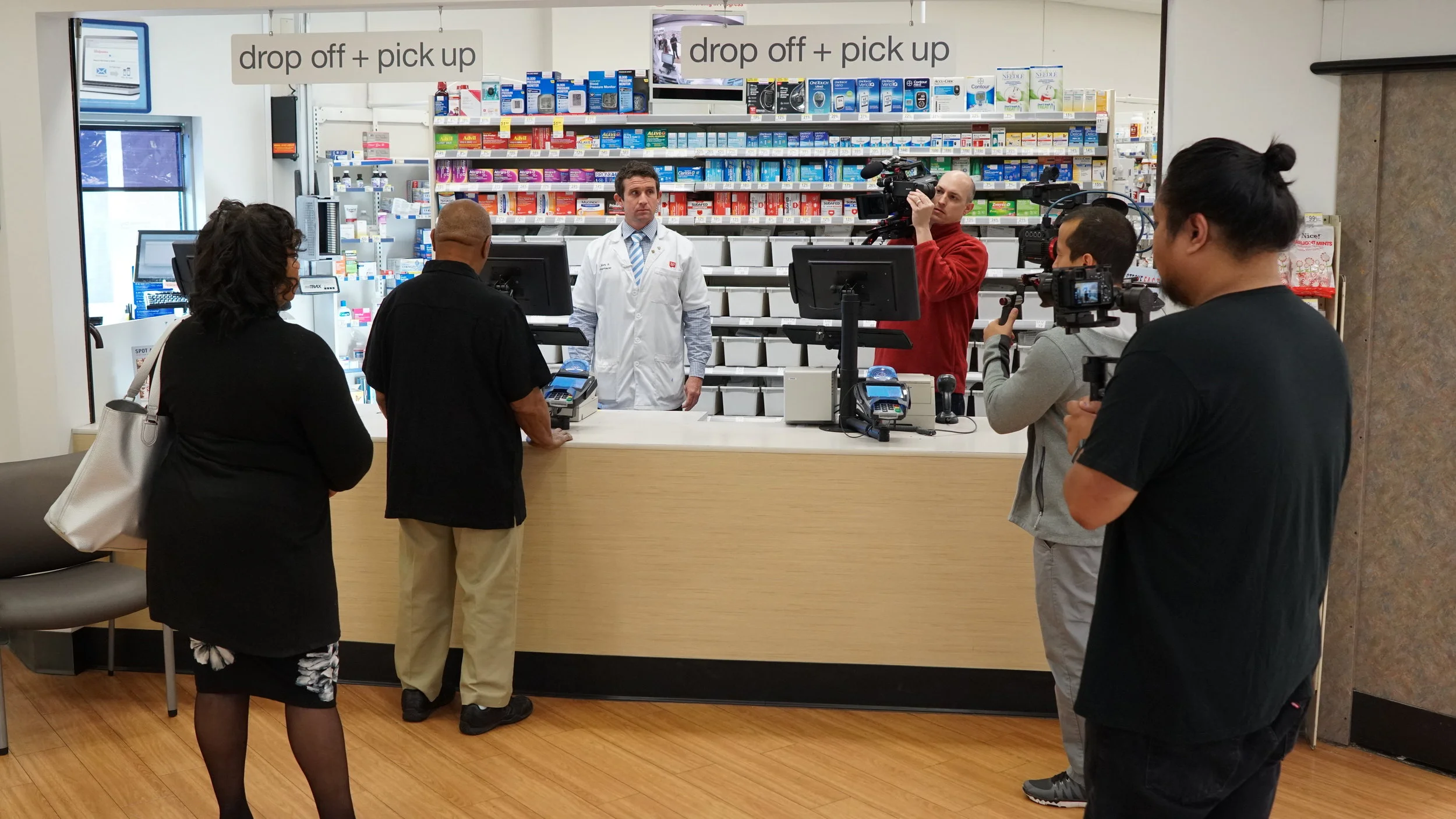 Lifetime Media crew on the set of scene 1 for real-time stroke simulation @ Walgreens Pharmacy w/ actor Mr. Lee as stroke victim.