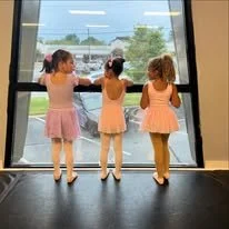 Preschool dancers at the studio window