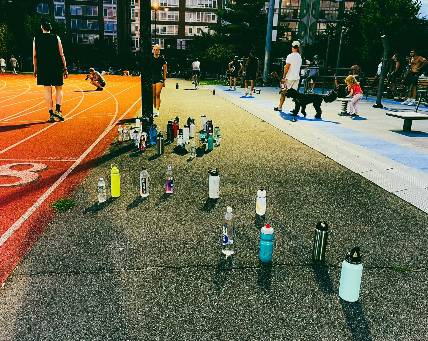 From &quot;My Walks&quot; Series: Thirst

#runners #mccarrenpark #waterbottles #summerevenings #brooklyn #williamsburg #greenpoint #runningtracks