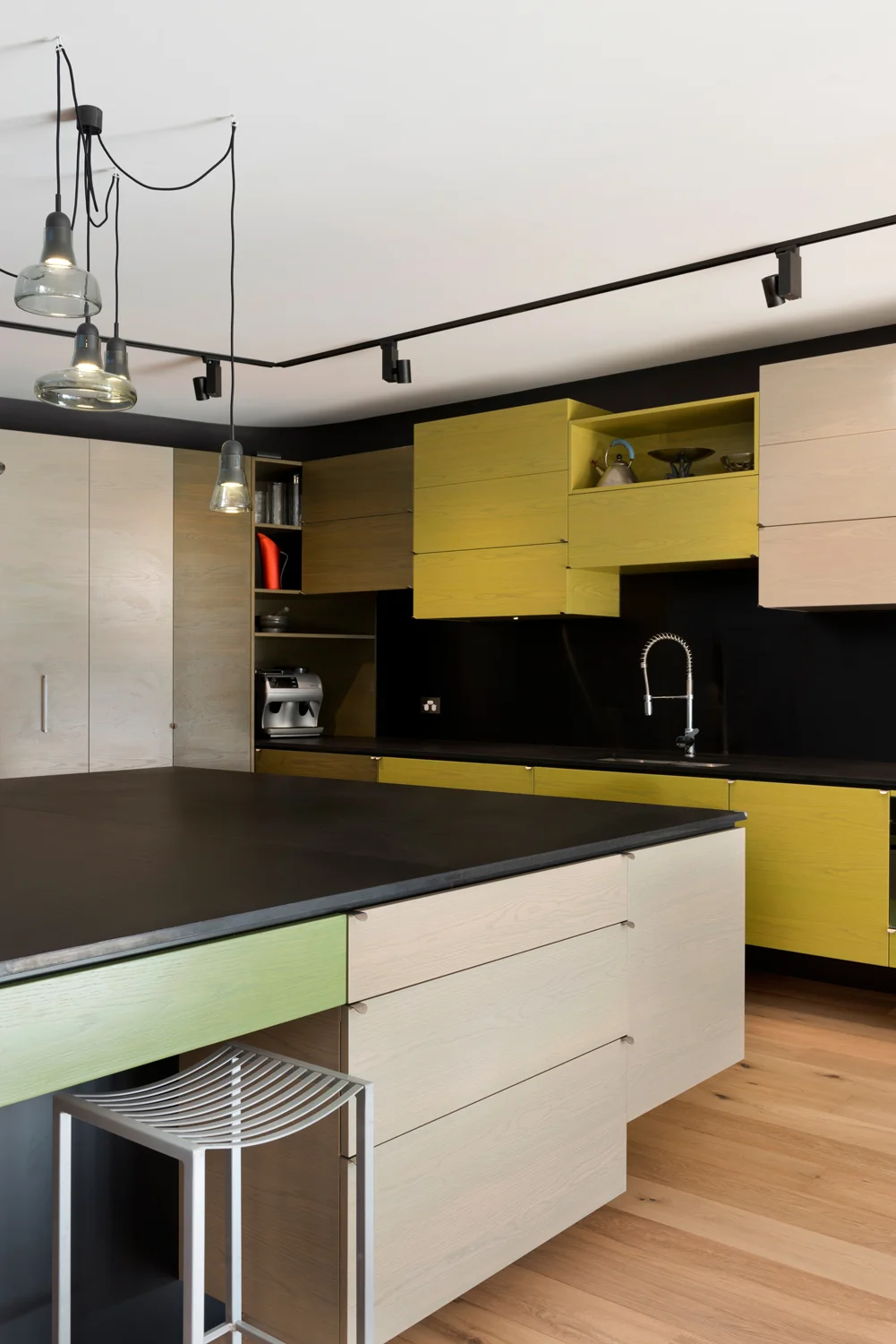 Contemporary large kitchen with updates retro colors and design detail angle.