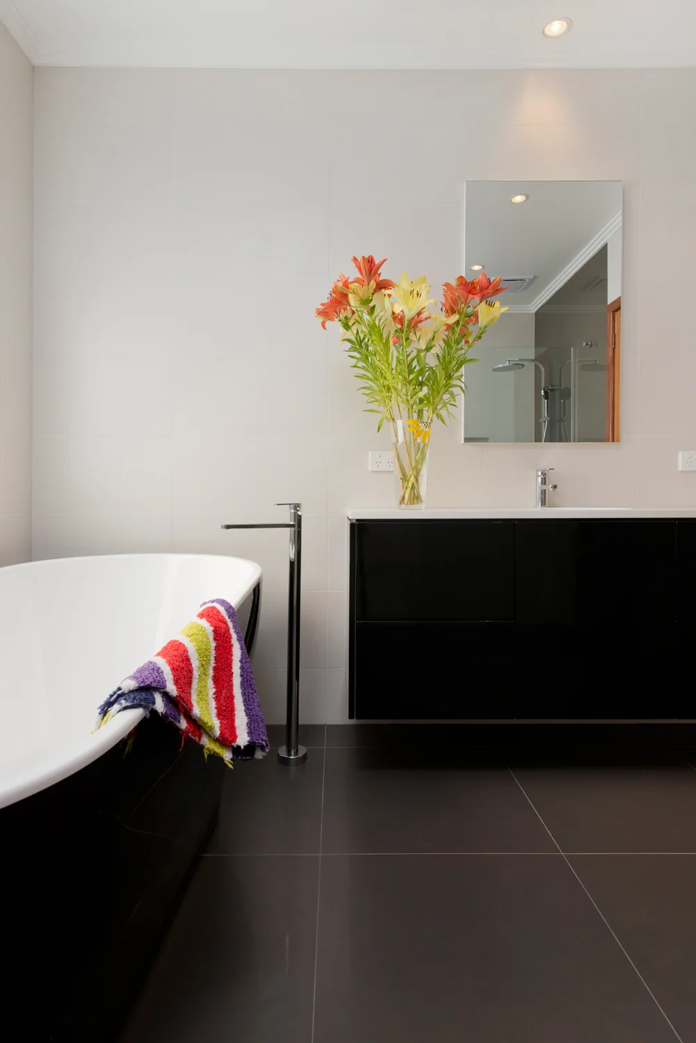 Bathroom detail image, simple design and freestanding tub.