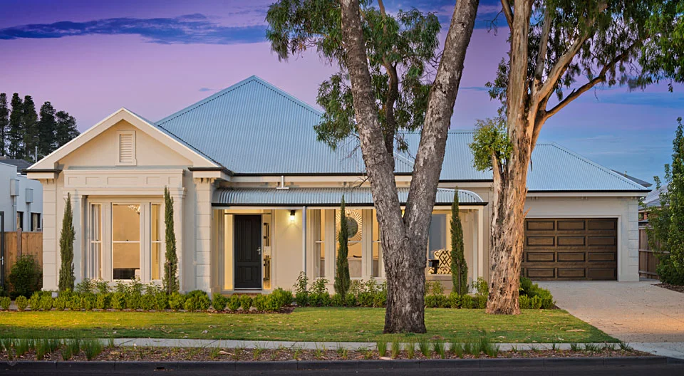 Traditional Family Home in modern proportions dusk front external photo.