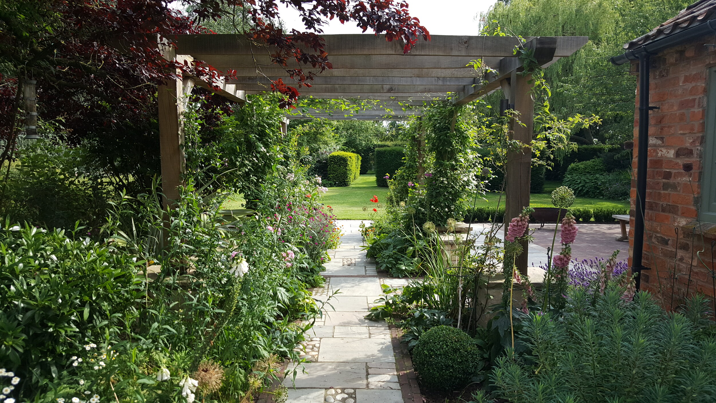 10 Garden design Lincolnshire - path under oak pergola.jpg
