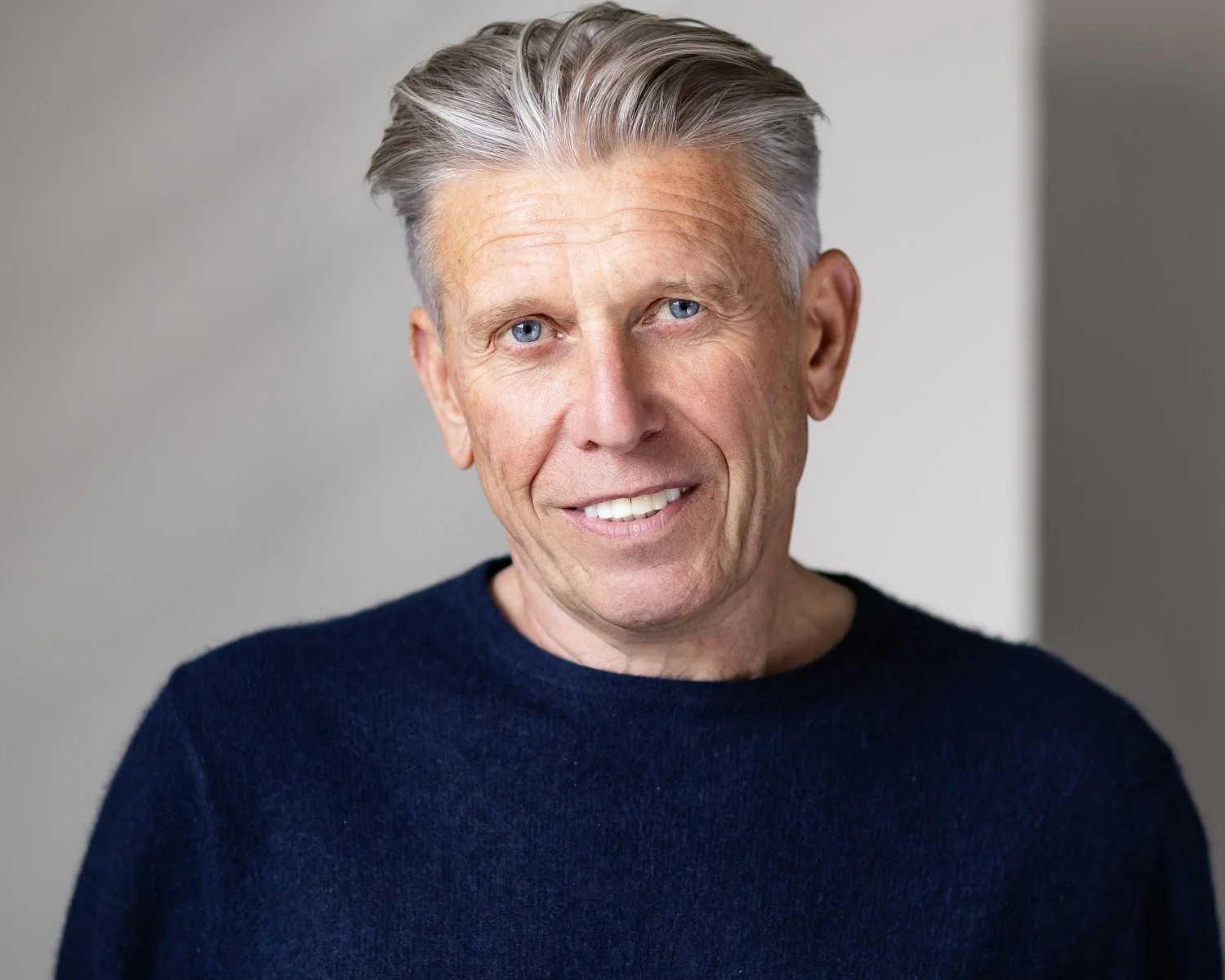 Naturally lit actor headshots man in his 60’s in a blue jumper