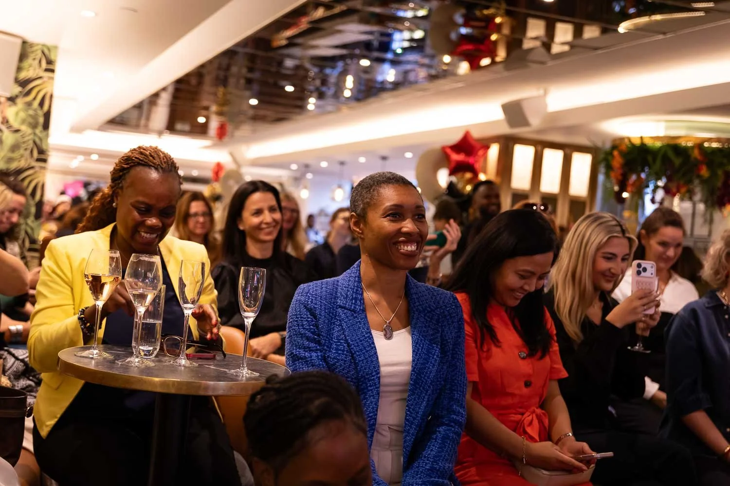  A female audience enjoying a speaker event 