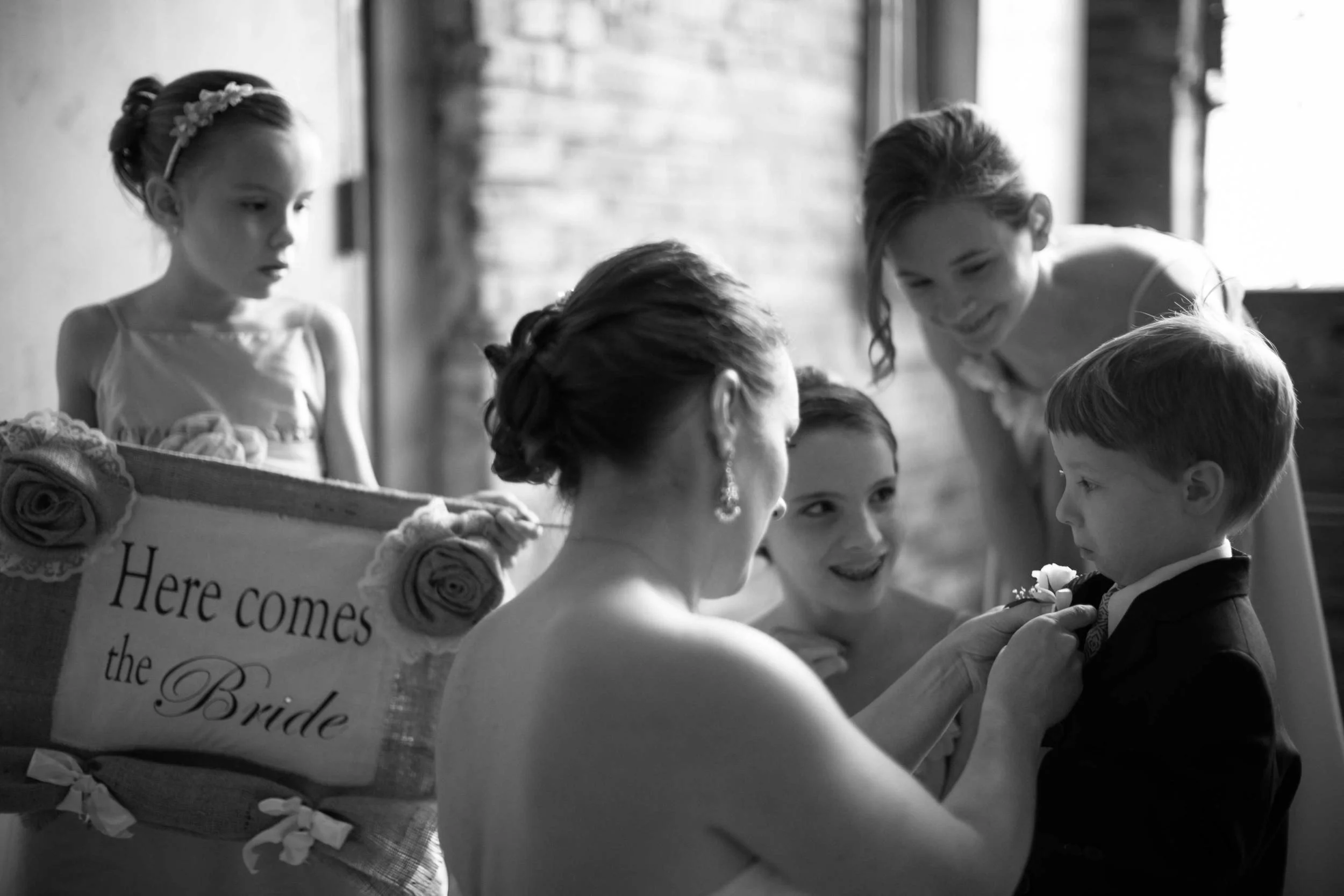 HE DOESN'T SEEM ALL THAT SURE ABOUT THIS WHOLE BOUTONNIERE THING.