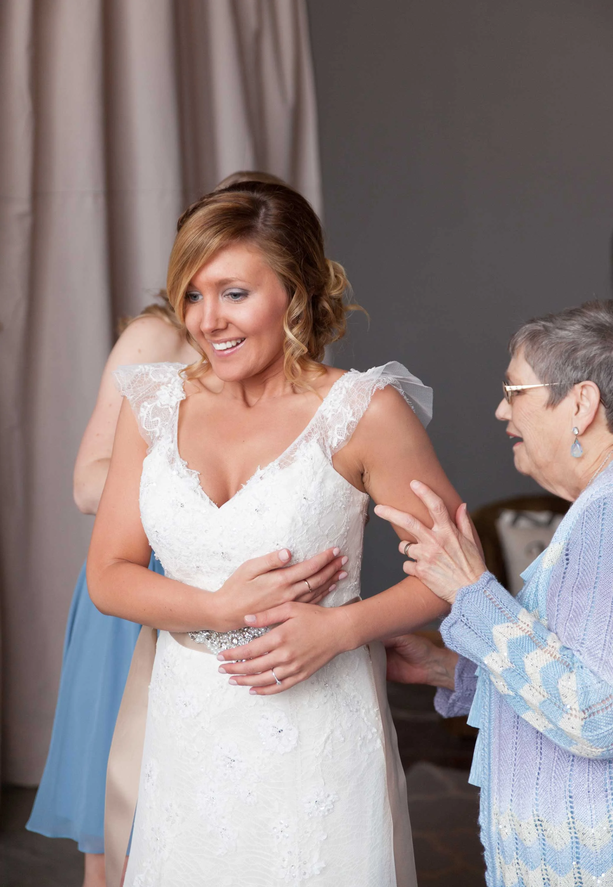 ...AND CATCHES HER BREATH SEEING HERSELF IN HER WEDDING DRESS ON HER BIG DAY.