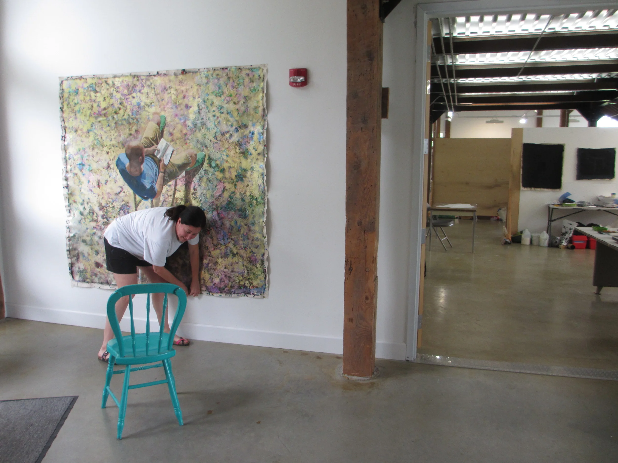  Fellow Resident Eva Navarro hanging up a painting of me! (The only one I know of in existence.) She's great. 