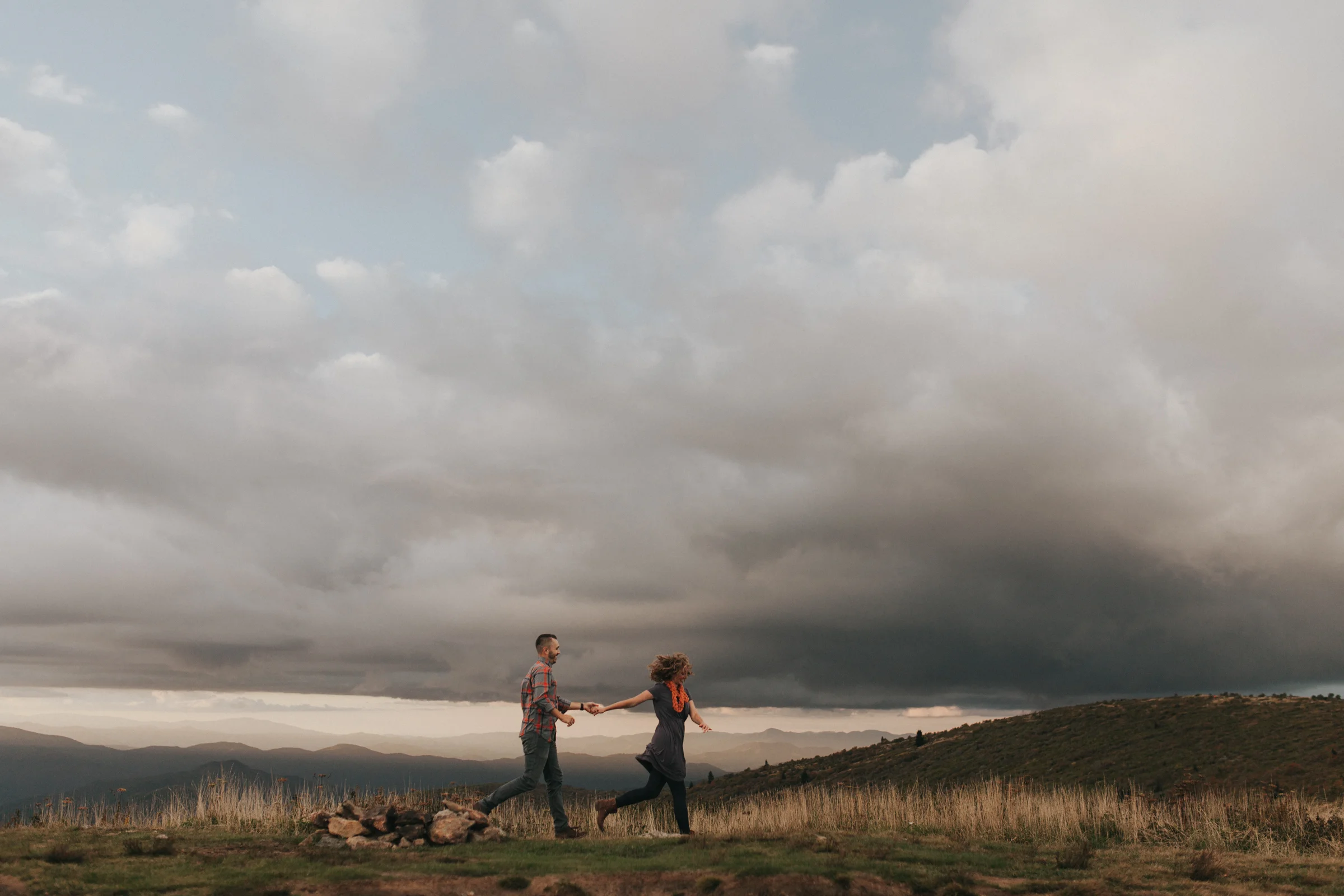 Couple runs through field on Black Balsam Mountain