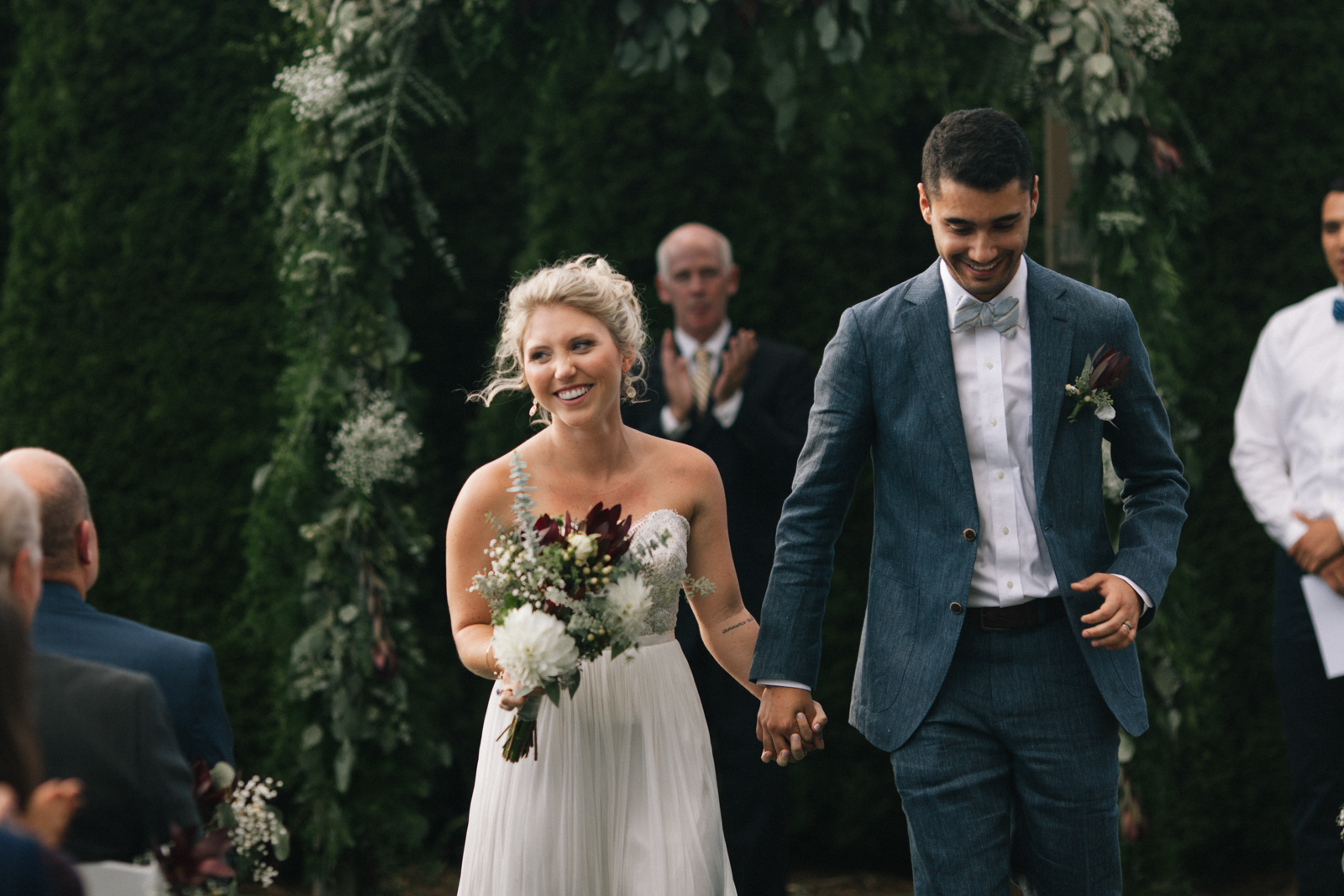 Couple walking down the aisle of their wedding at the Inn at Crestwood in Boone, North Carolina. 