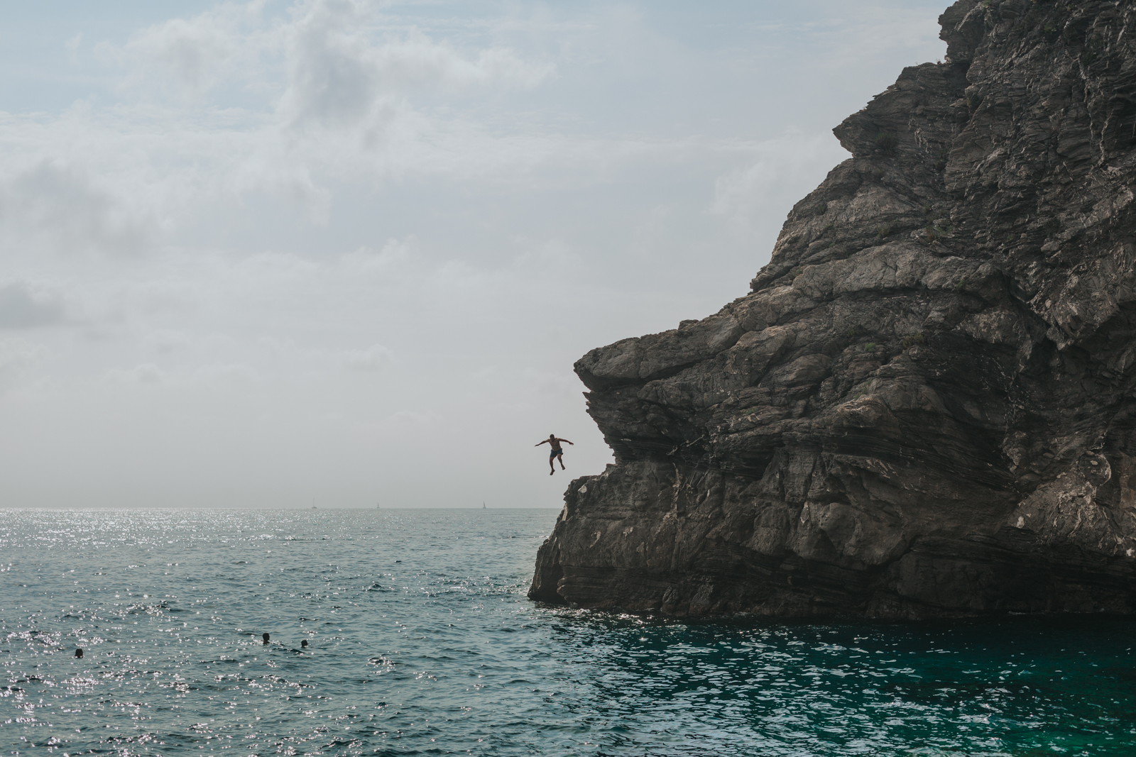 Cliff jumping in Cinque Terre, italy. 