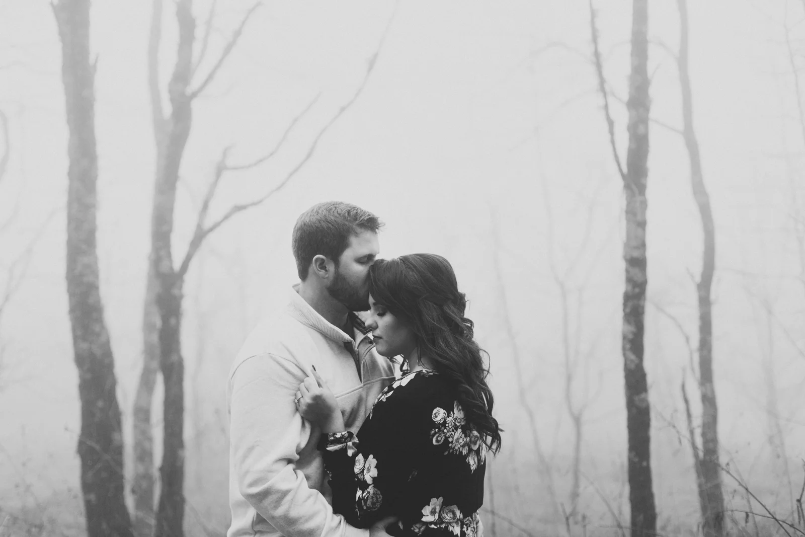 Couple gets close during an engagement session at Max Patch Mountain, 