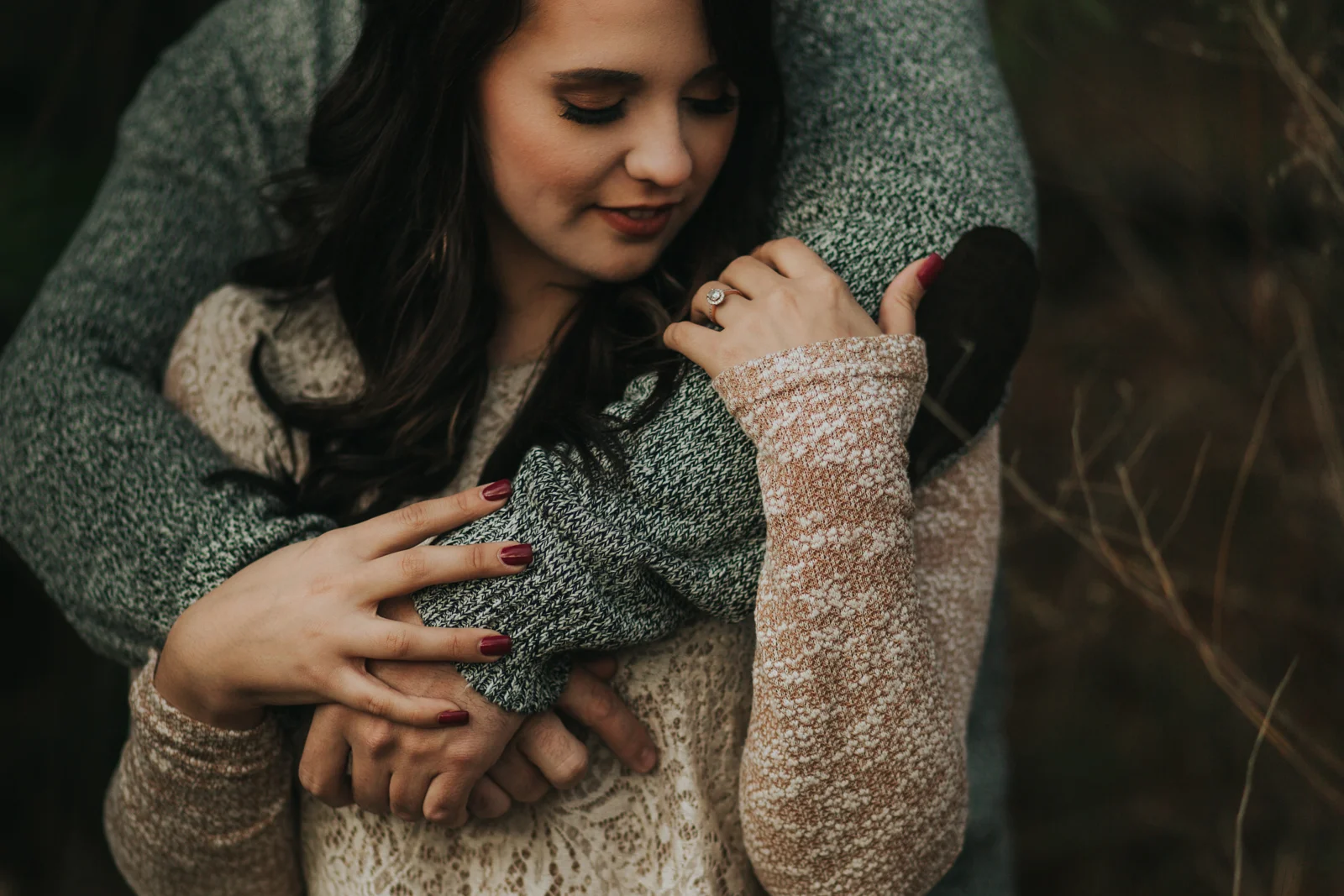Man and woman get close on a cold day at Max Patch in North Carolina. 