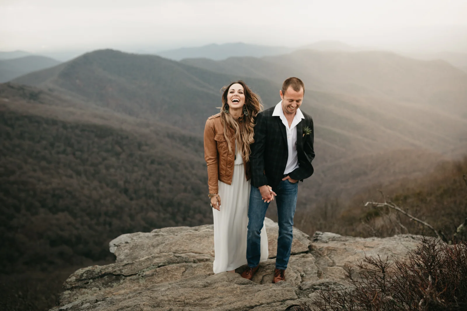 Newly married couple on the side of a mountain in Asheville, North Carolina.