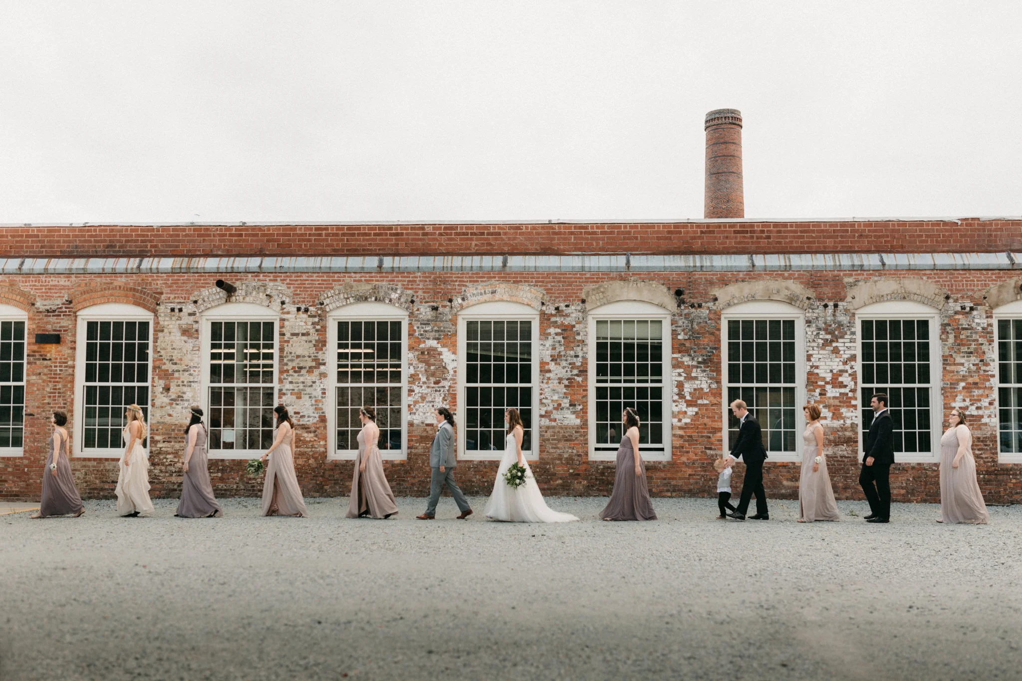 Bridal party at a same sex wedding at an old cotton mill in North Carolina. 