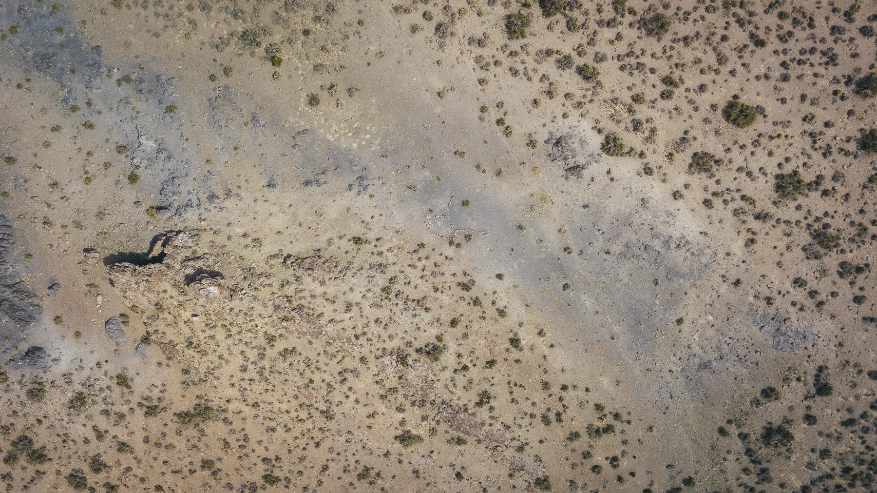 Cave dwelling inhabited by several distinct groups: pre-historic man, current era Native Americans, and early 19th century European ore prospectors. Includes geoglyphs and other rock features only visible from above. 