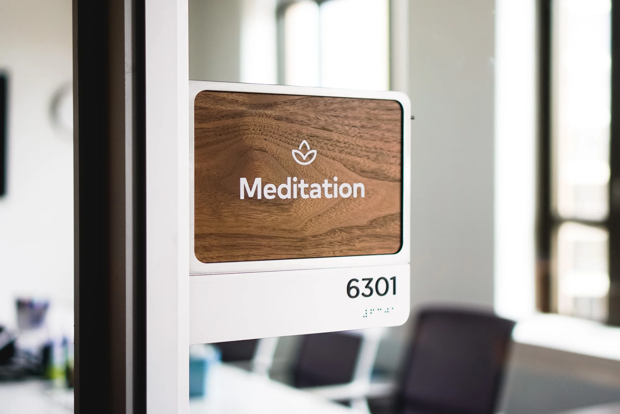 Each of the 60 rooms in the office has it’s own walnut name-card, with a corresponding neighborhood meta icon. The extra icon helps reinforce the system so eventually people just understand where they are going without even having to look.