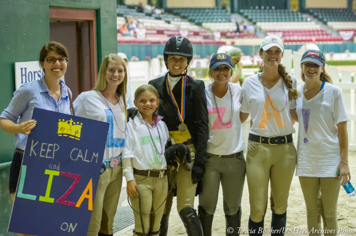 Liza Boyd and members of her fan club celebrate her 2013 WCHR Professional Finals victory.