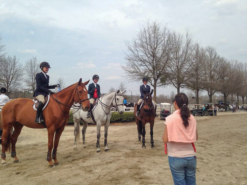 Trainer Liza Boyd and the Finally Farm equitation riders celebrate their USEF Medal performances. 