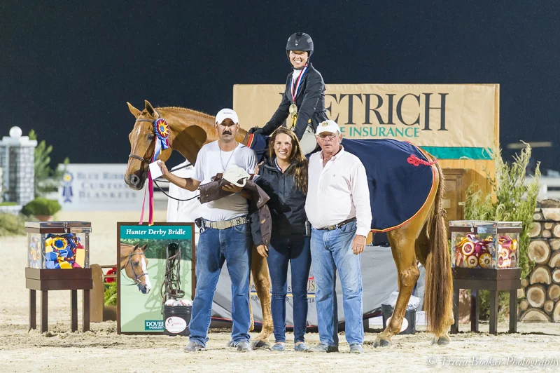 The Finally Farm team celebrates with Liza and Brunello center ring.