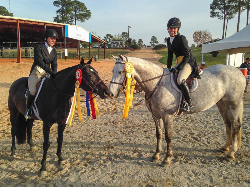 Liza Boyd and Sterling, right, celebrate their USHJA International Hunter Derby performance with winner Kelley Farmer aboard Mindful.