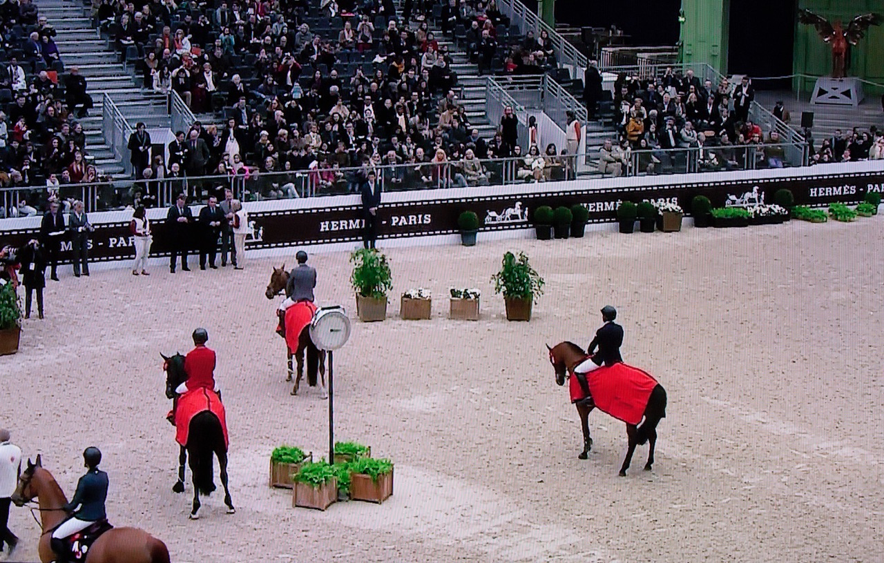 Hardin Towell, far right, waits to collect his second place aboard New York in the Prix GL Events class in Paris.